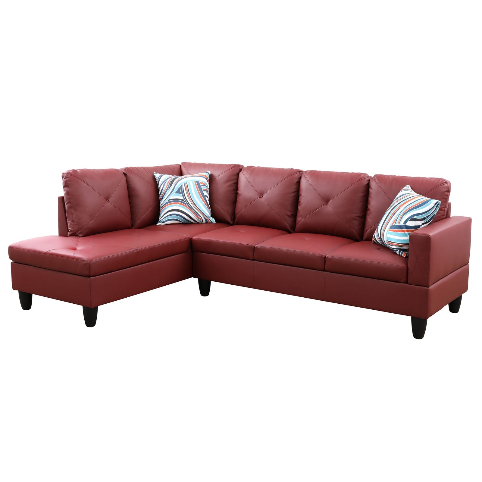 Red leather sectional sofa with tufted cushions and striped accent pillows