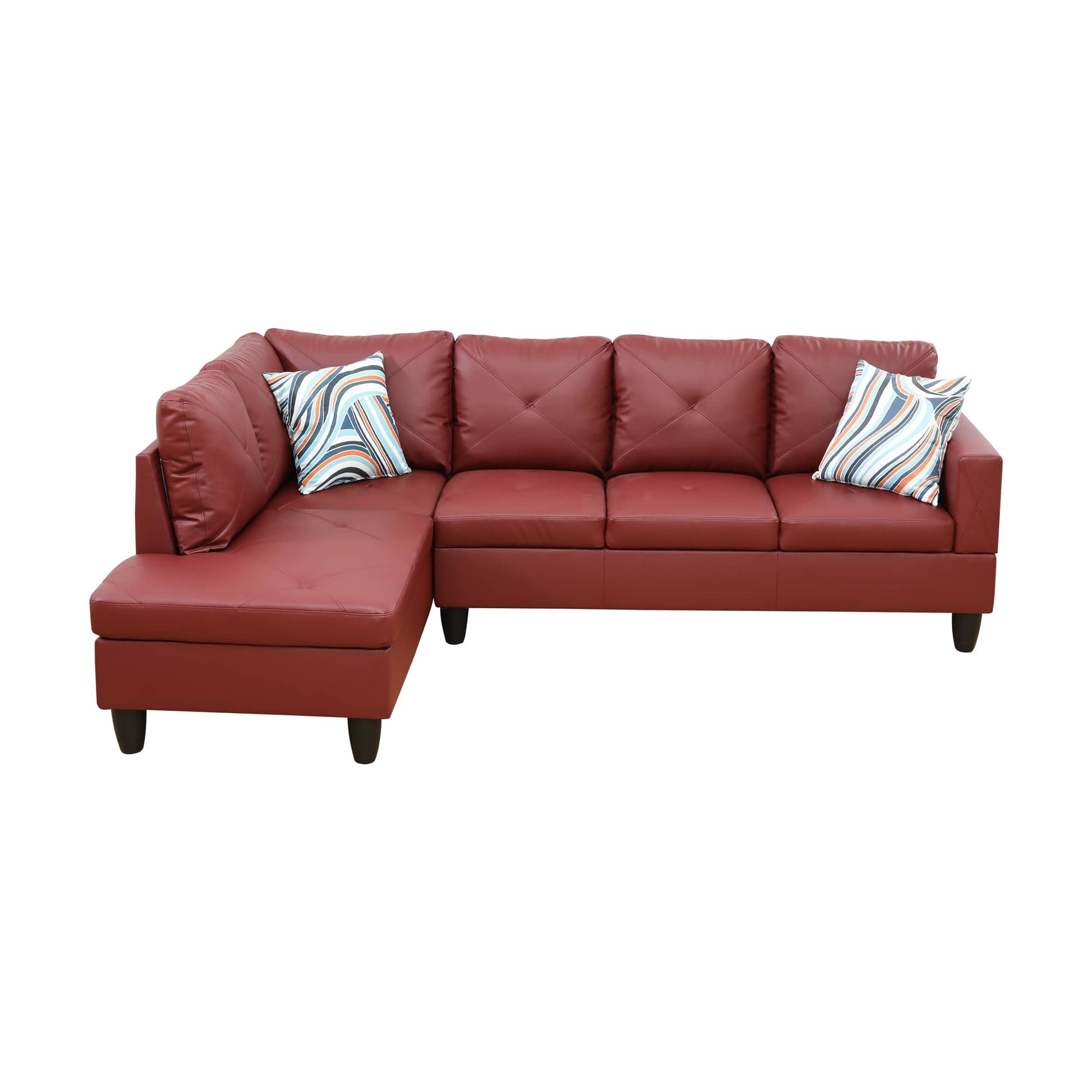 Red faux leather sectional sofa with chaise and patterned pillows