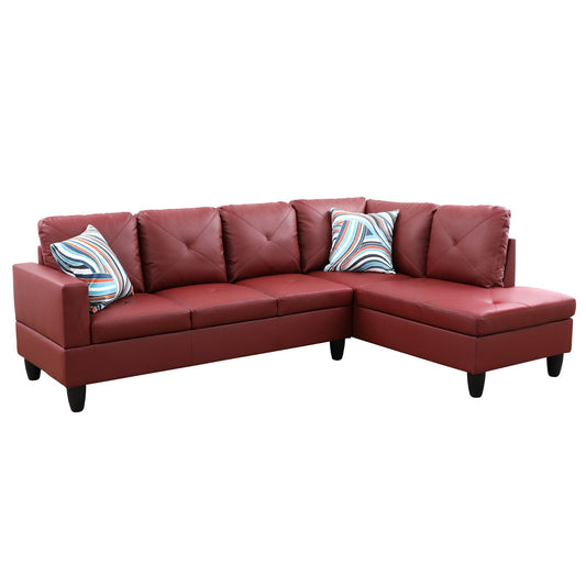Red leather sectional sofa with tufted cushions and modern striped pillows