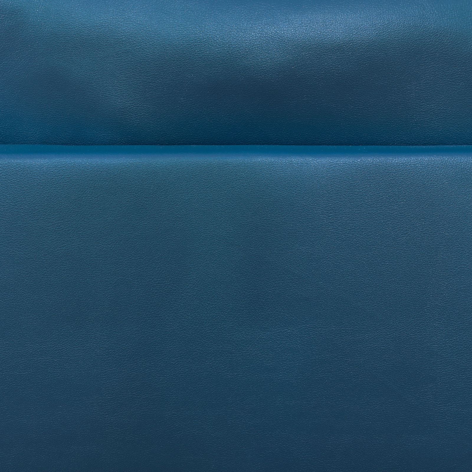Closeup of textured navy blue leather upholstery