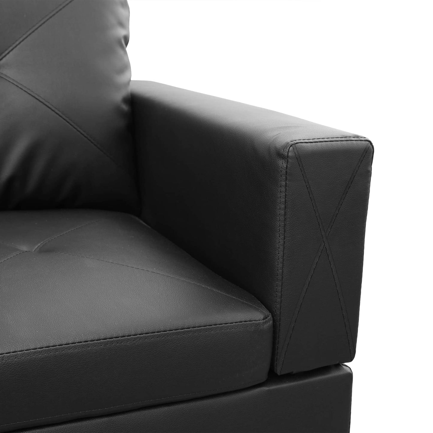 Black faux leather sofa arm with diamond stitching detail and piped seams
