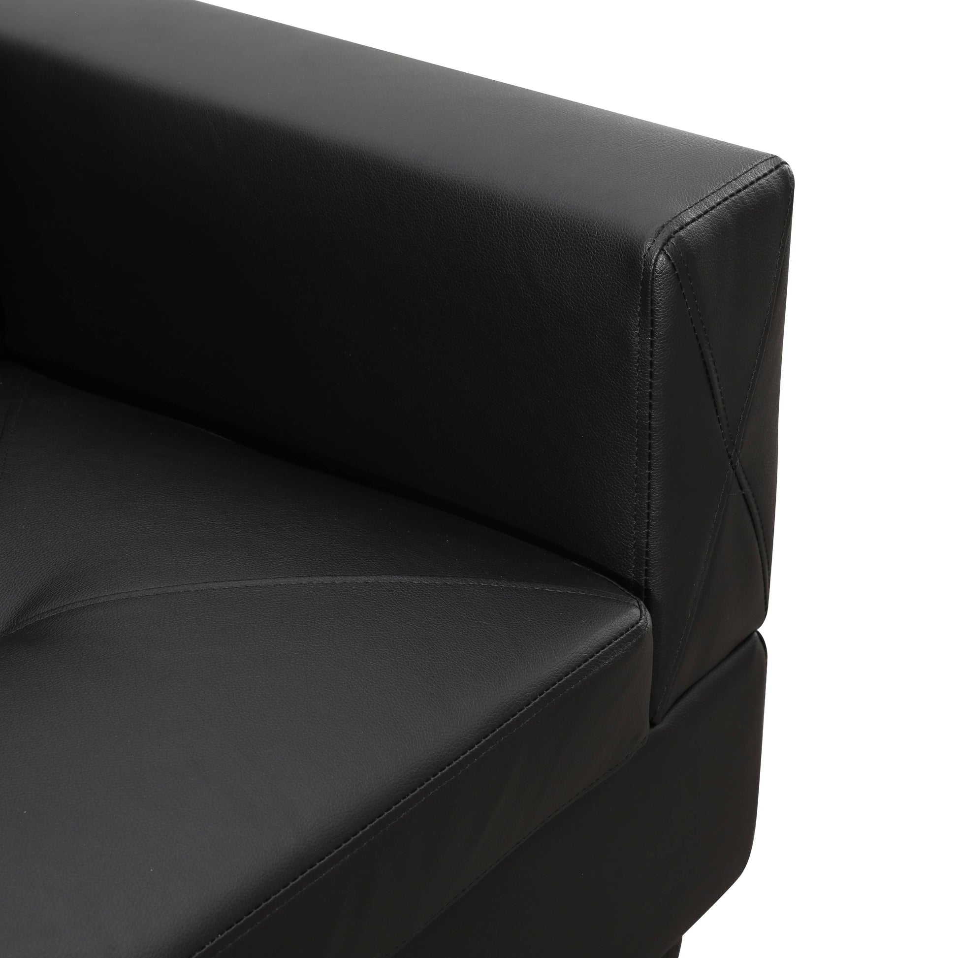 Black faux leather armchair detail with stitched diamond pattern