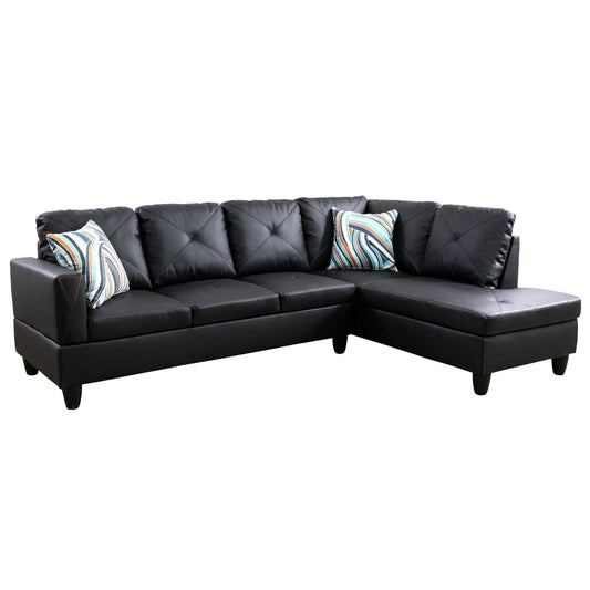 Black faux leather sectional sofa with diamond tufting and striped accent pillows