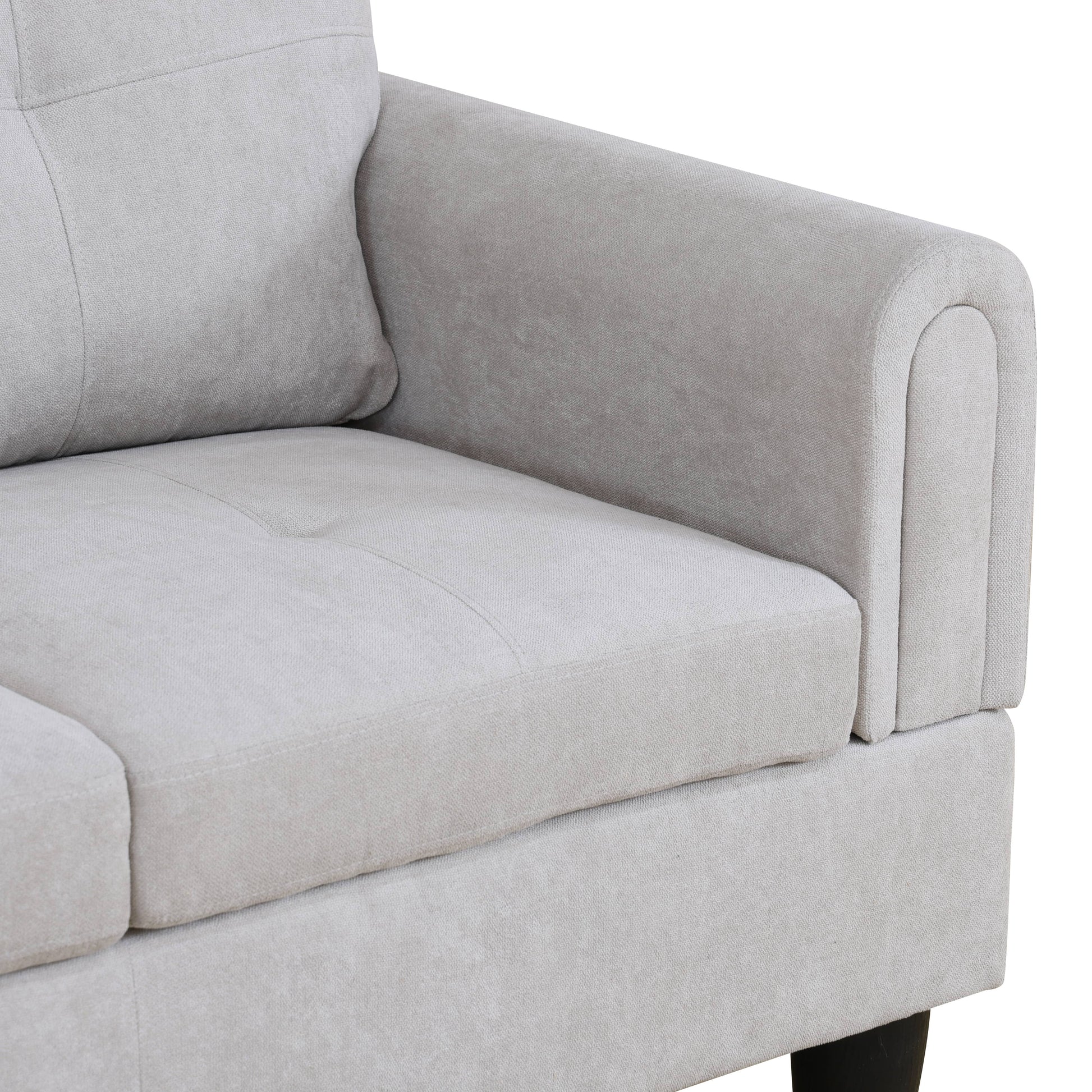 Light grey textured fabric sofa armrest with plush cushioning