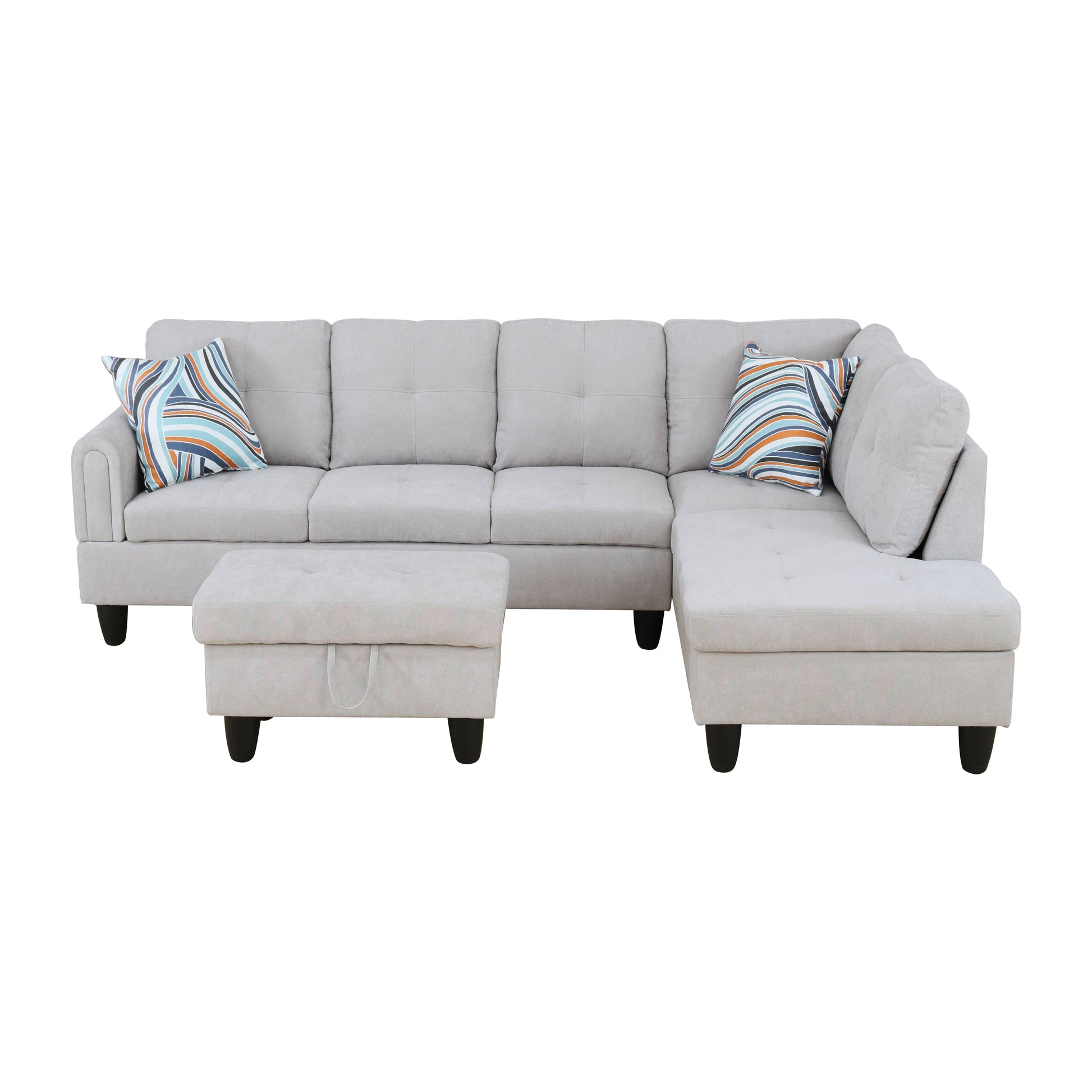 Light grey fabric sectional sofa with tufted cushions and striped throw pillows