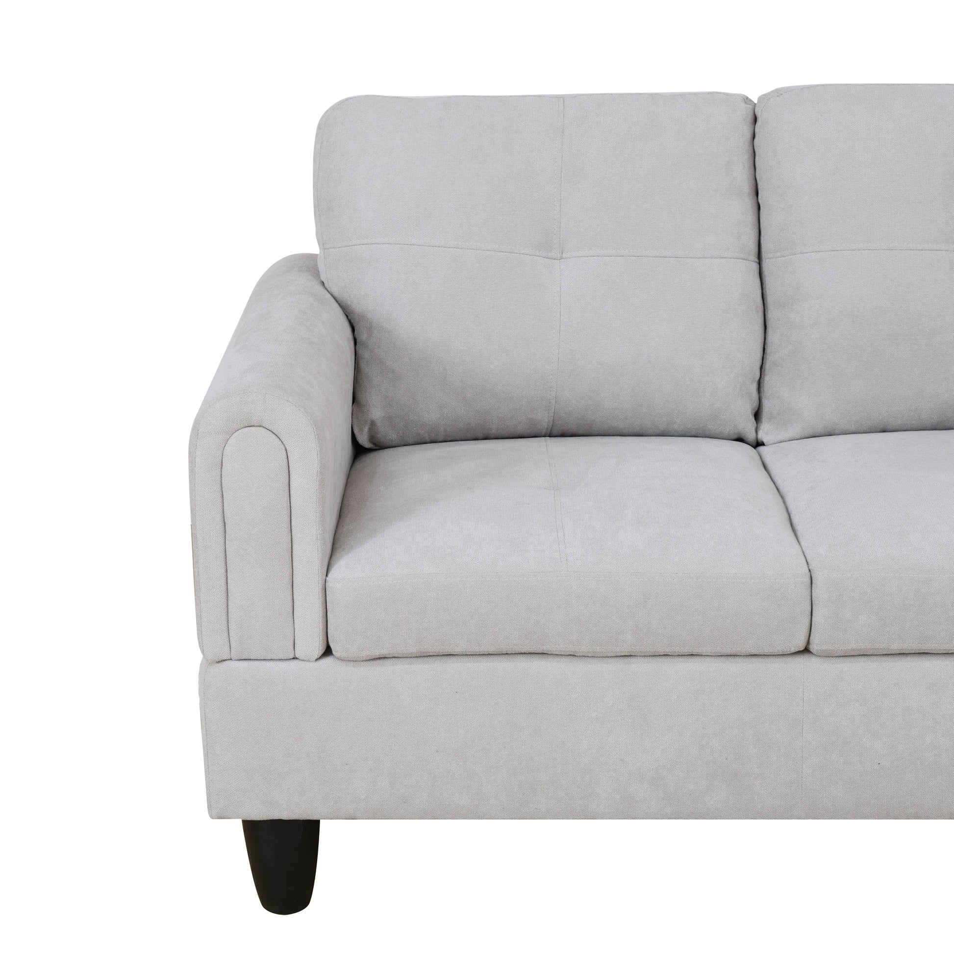 Light gray fabric sectional sofa with tufted back cushions