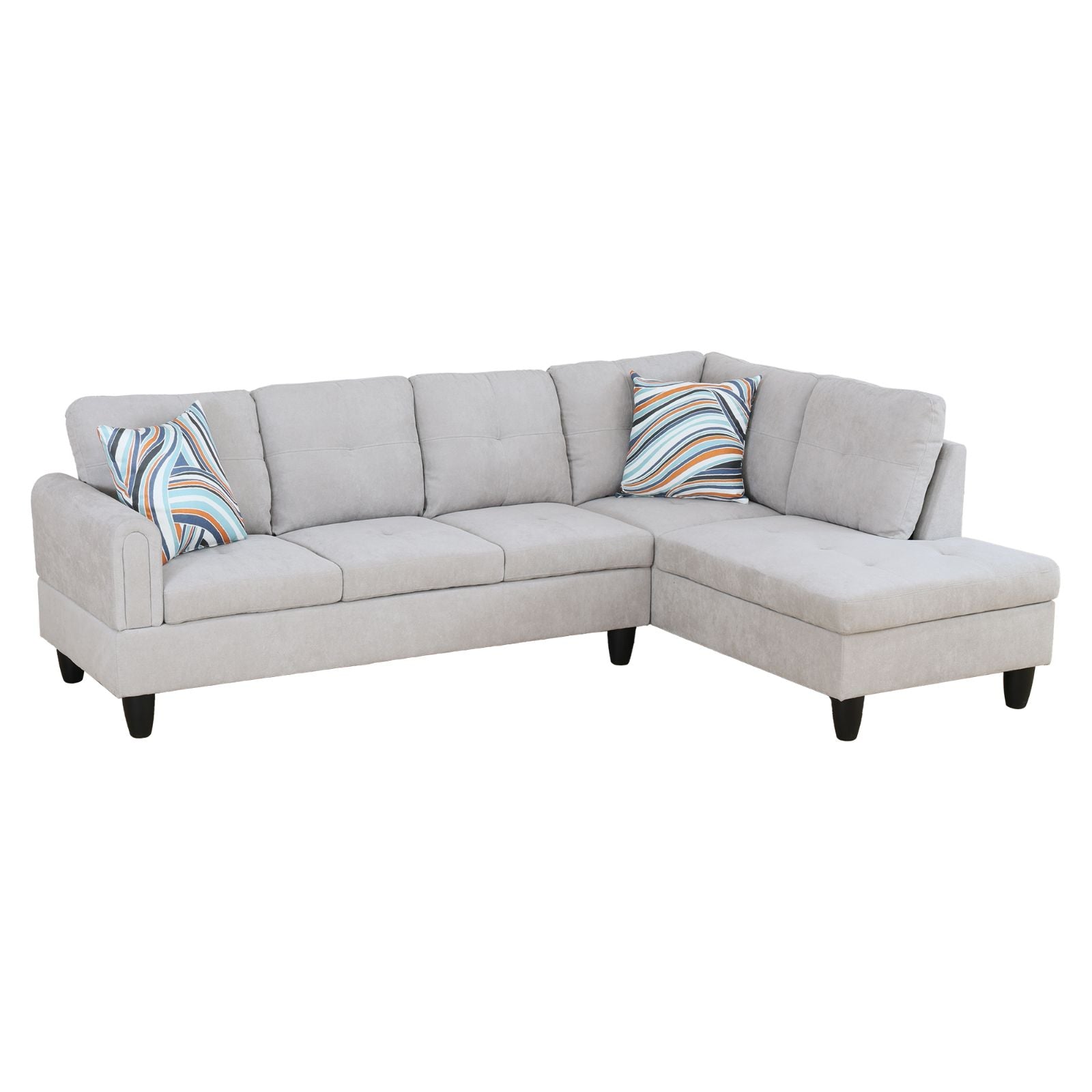 Light gray fabric sectional sofa with abstract striped accent pillows