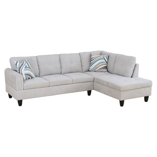 Light gray fabric sectional sofa with abstract striped accent pillows