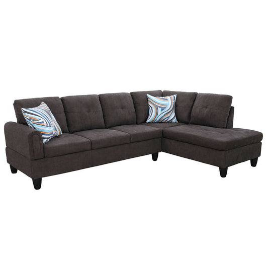 Dark charcoal fabric sectional sofa with patterned throw pillows