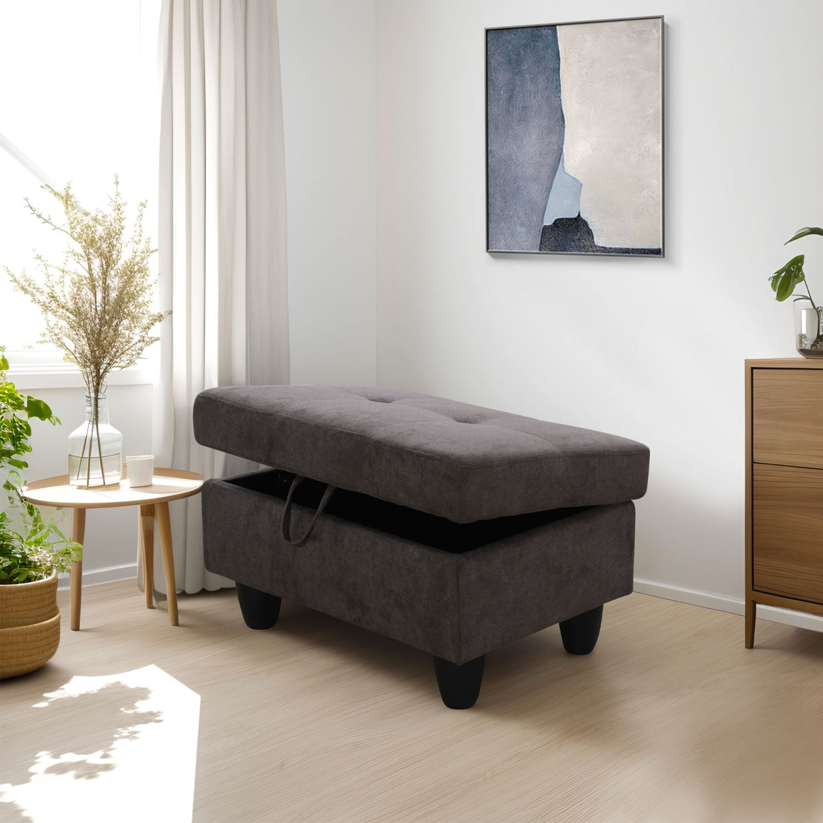 Dark grey fabric storage ottoman with tufted top