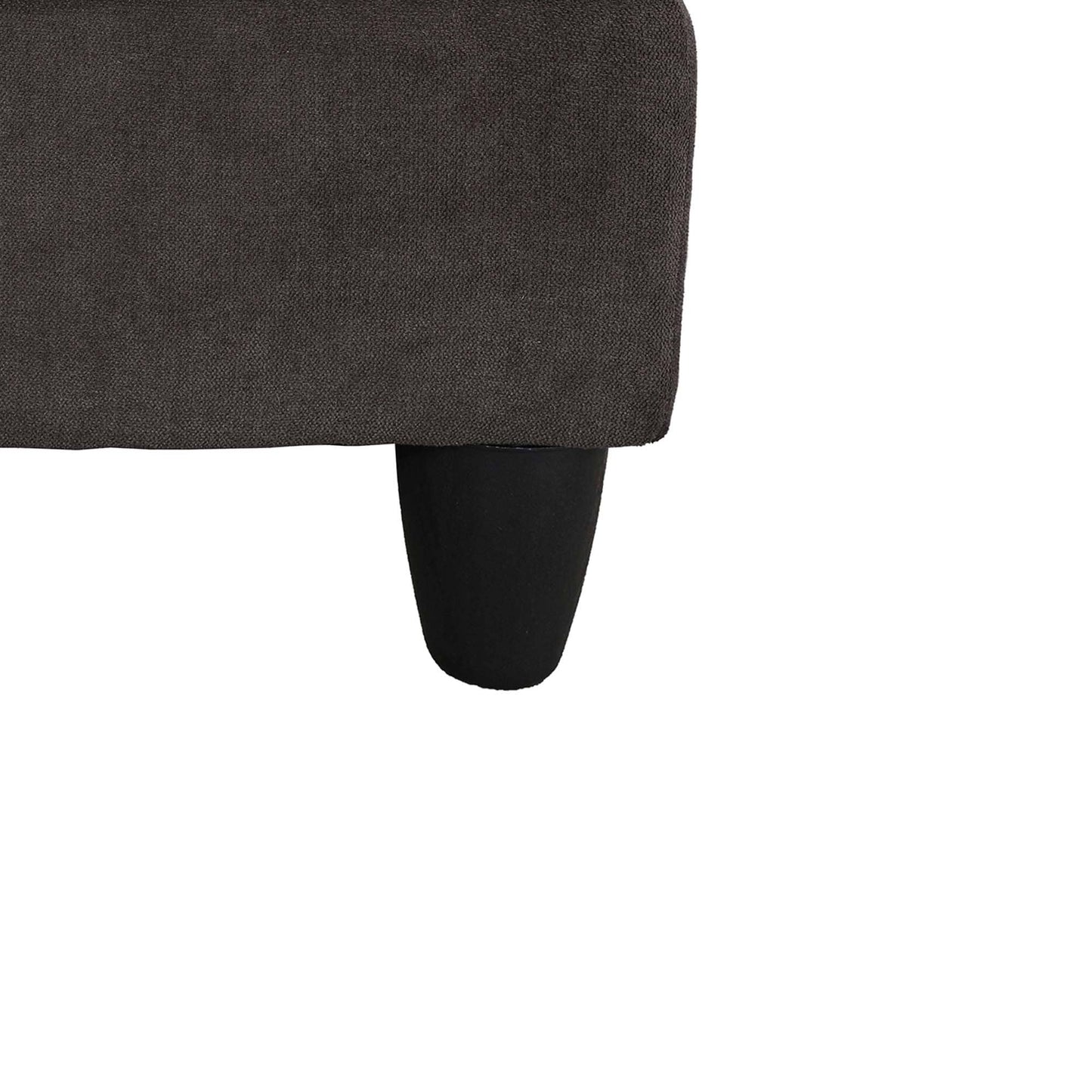 Dark brown textured fabric sofa corner with a tapered black leg
