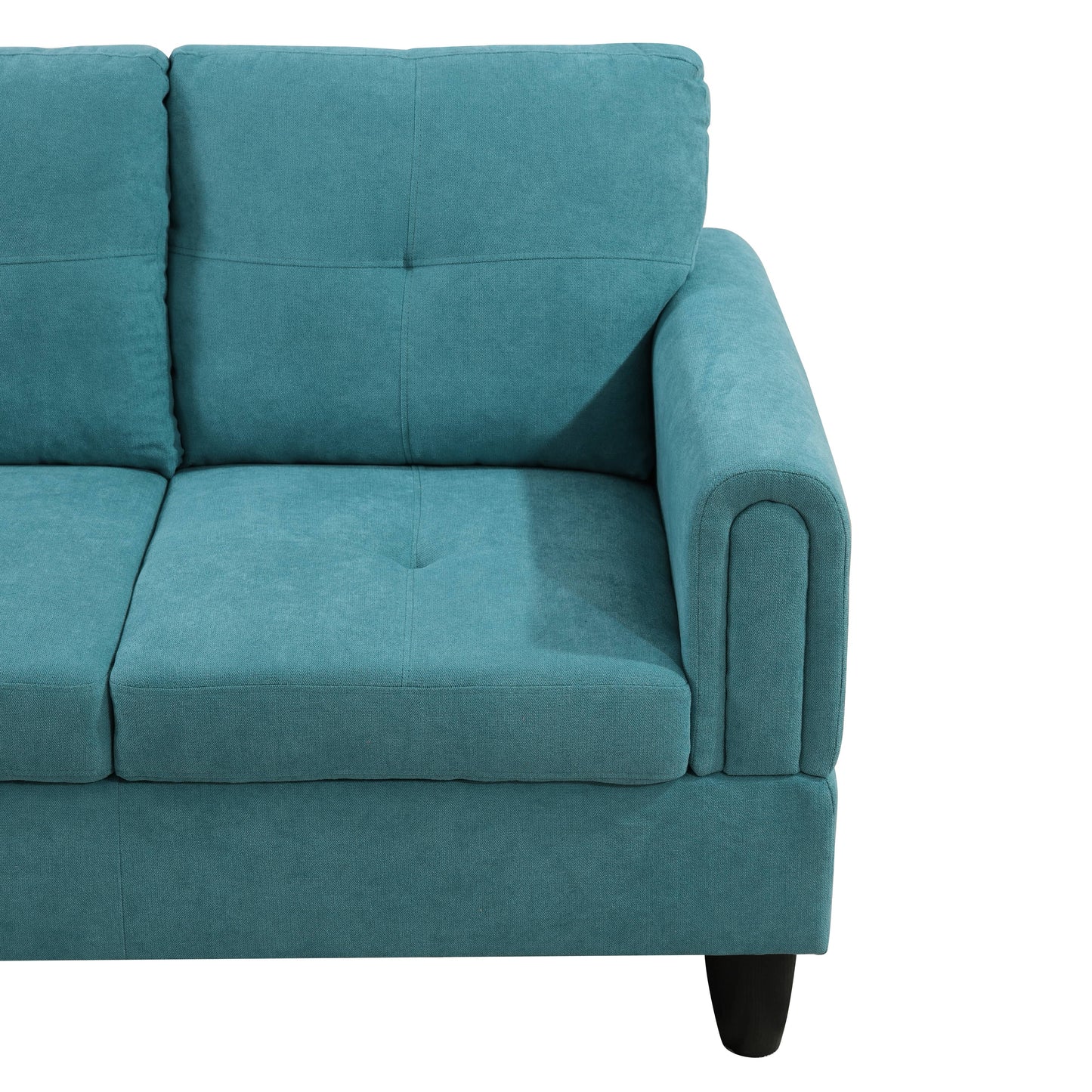 Teal upholstered sofa with tufted back cushions and rolled armrest