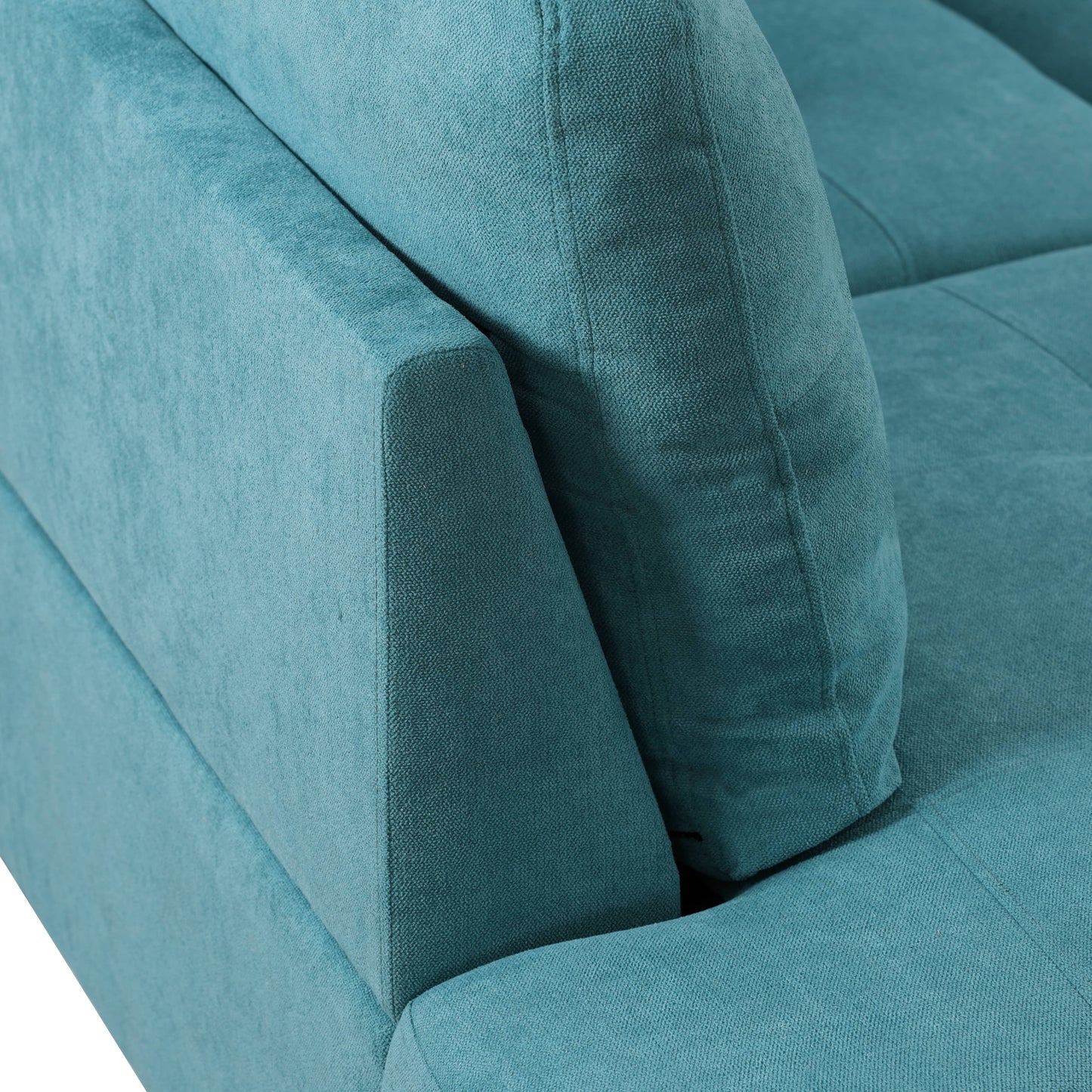 Teal fabric sofa armrest detail with textured upholstery