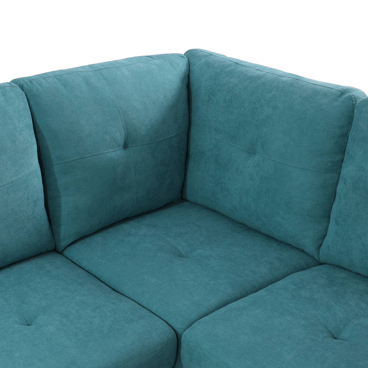 Teal upholstered sectional sofa with tufted seat cushions