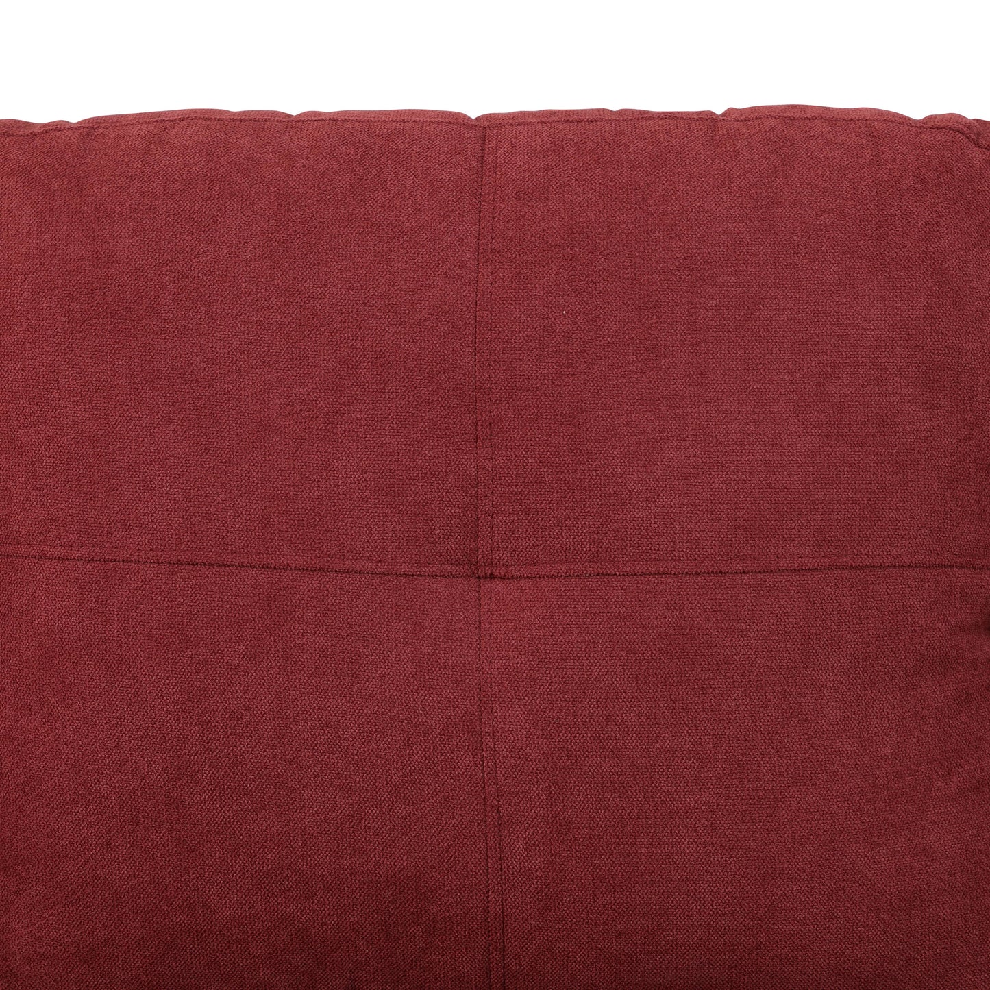 Deep red textured fabric closeup with quilted panel