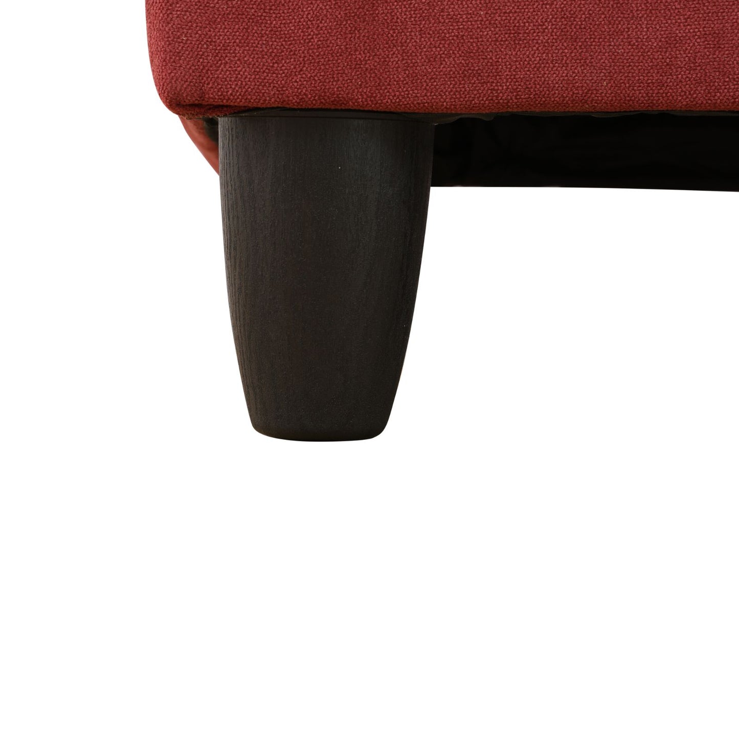 Textured red fabric sofa leg detail