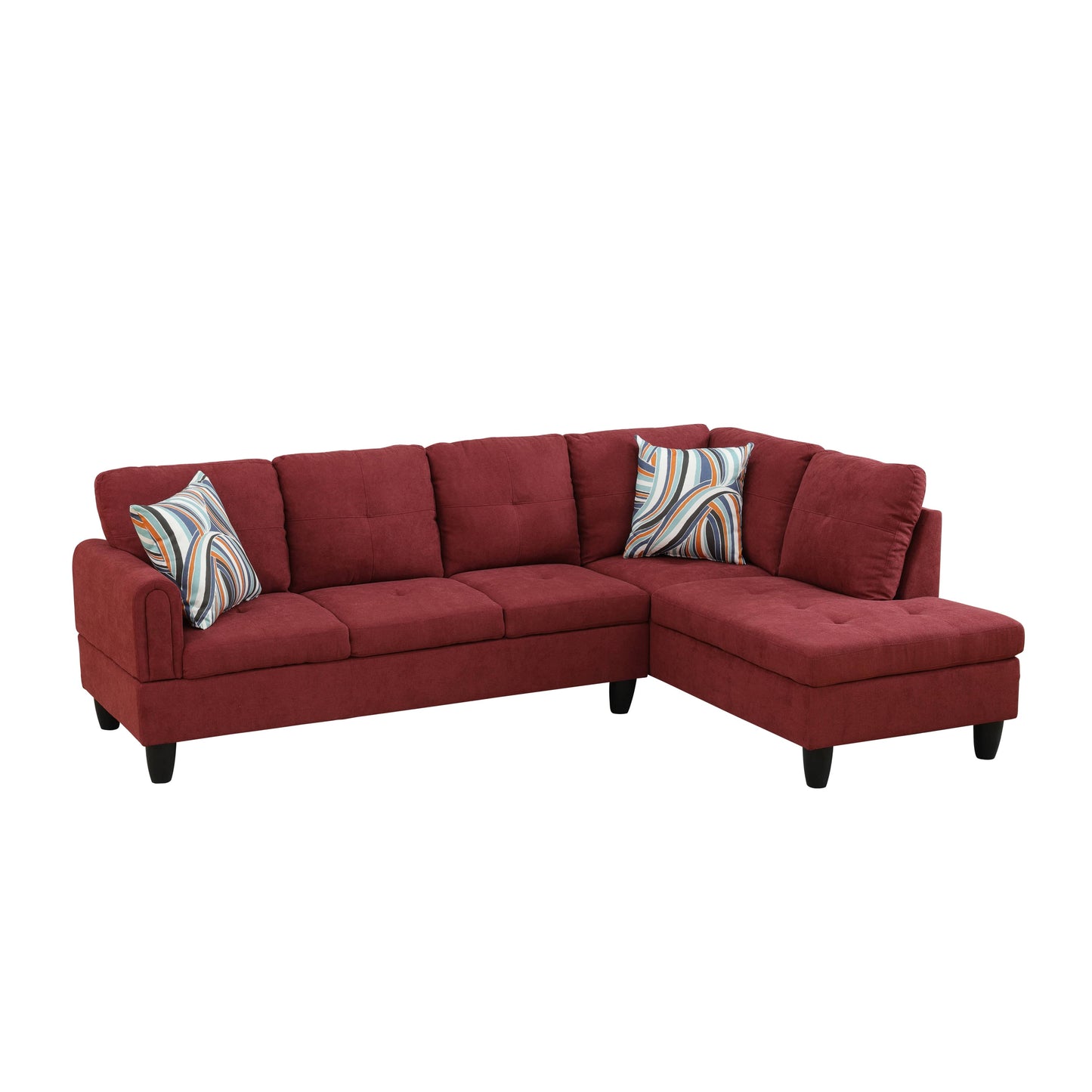 Deep red upholstered sectional sofa with tufted seat cushions and modern striped throw pillows