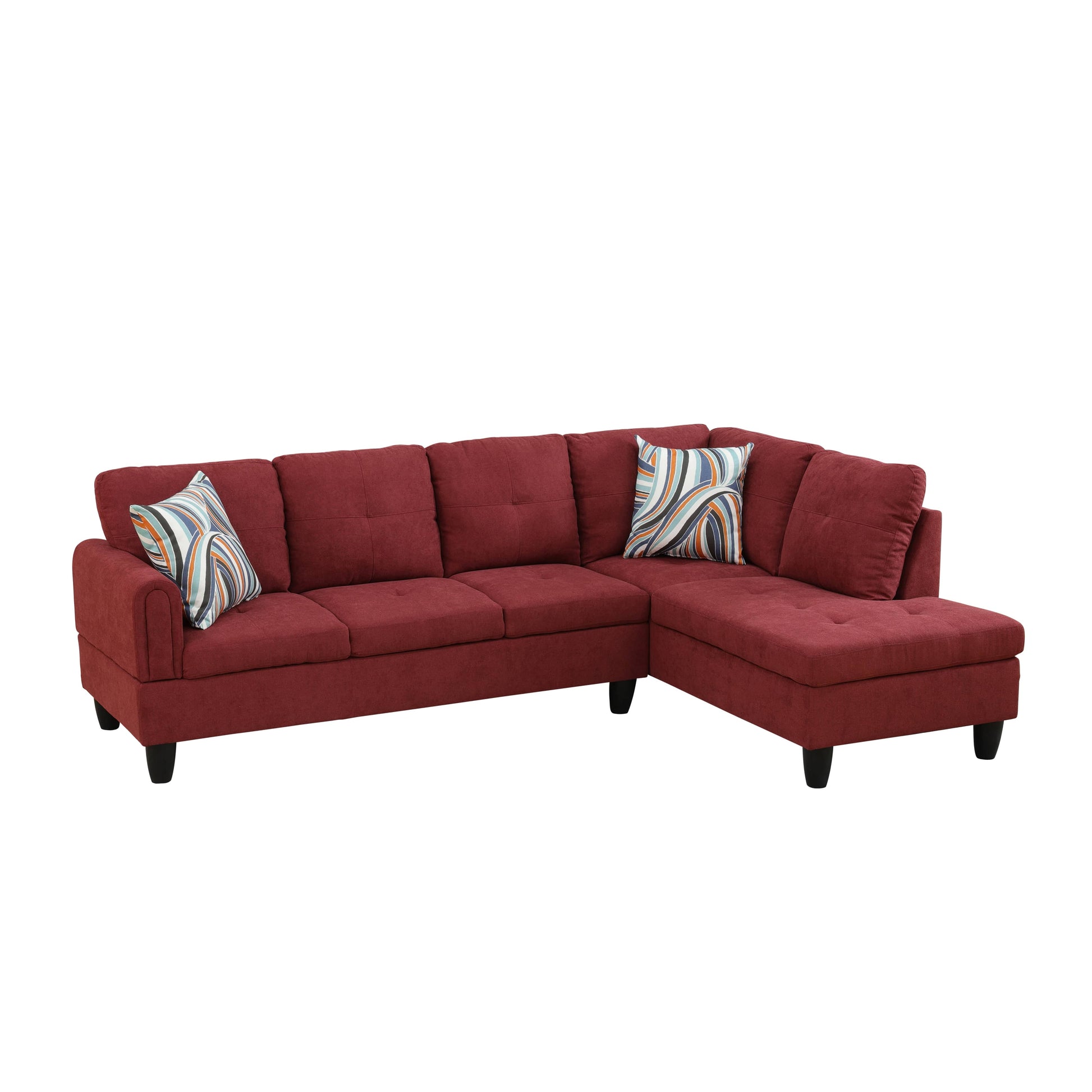 Deep red upholstered sectional sofa with tufted seat cushions and modern striped throw pillows