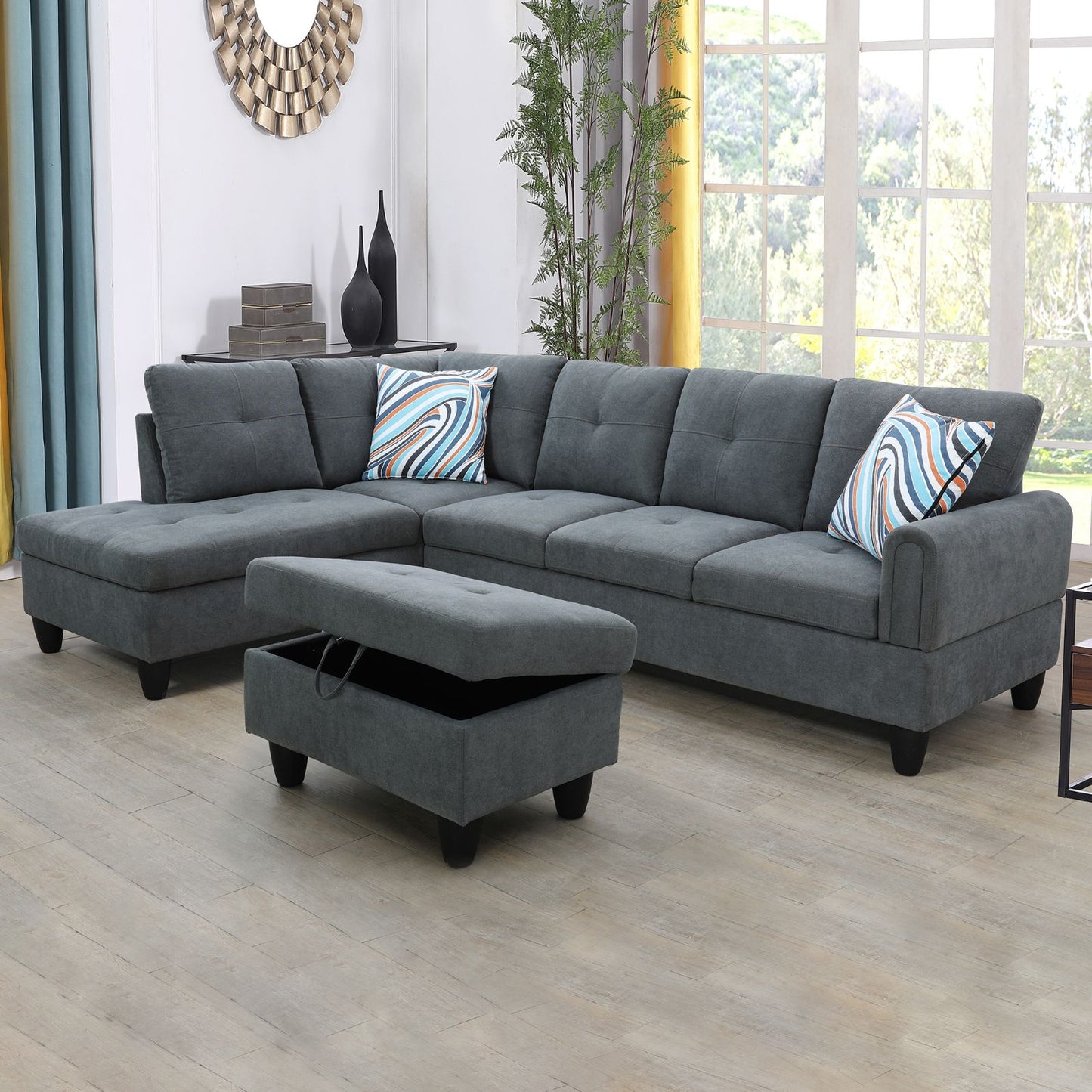 Dark gray sectional sofa with storage ottoman and colorful accent pillows