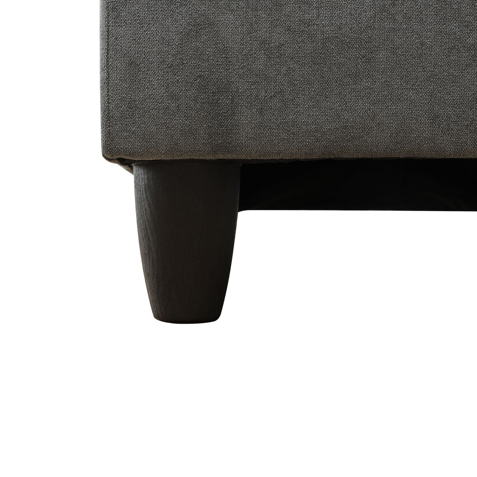 Dark grey fabric sofa with tapered wooden legs