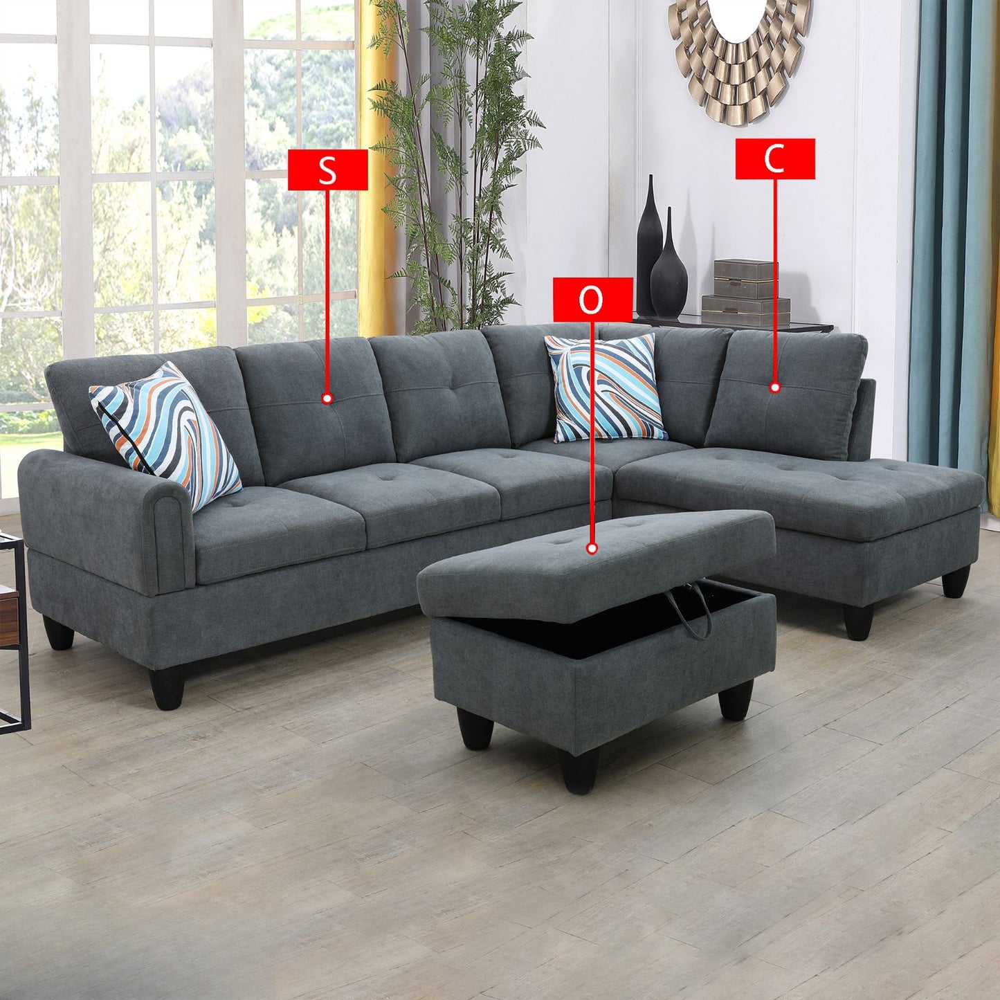 Dark gray fabric sectional sofa with tufted cushions and patterned throw pillows