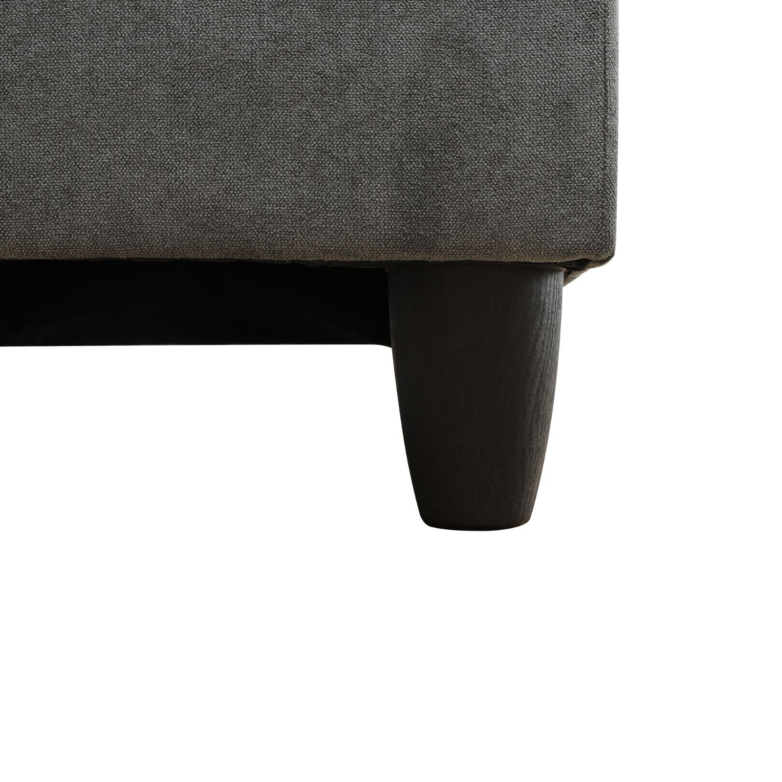 Dark grey textured fabric sofa with tapered wooden legs