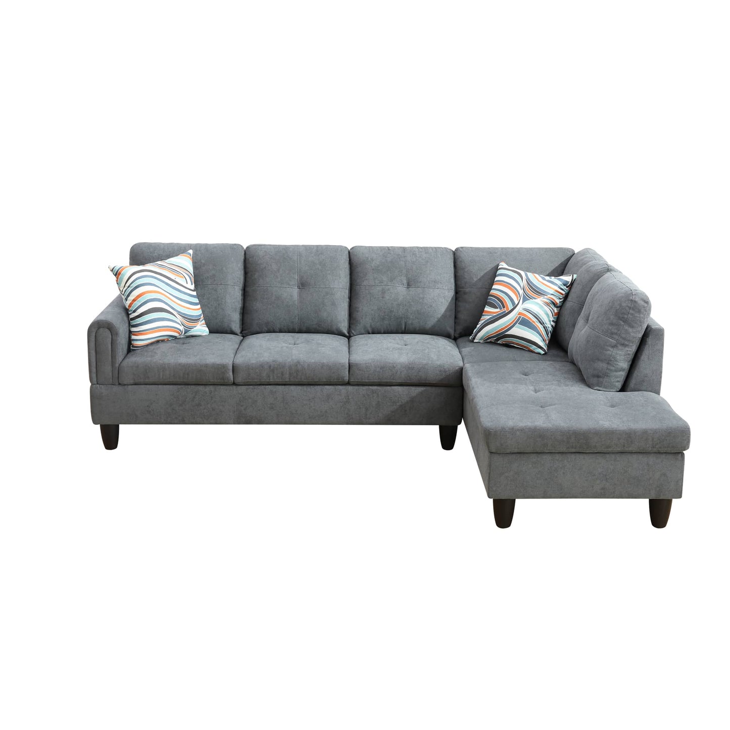 Gray fabric sectional sofa with tufted cushions and decorative pillows