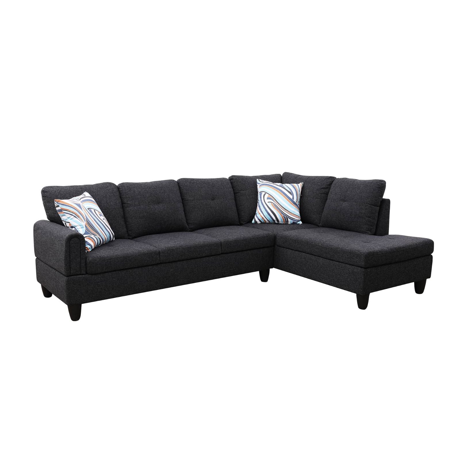 Dark grey fabric sectional sofa with modern tufted cushions and abstract print pillows
