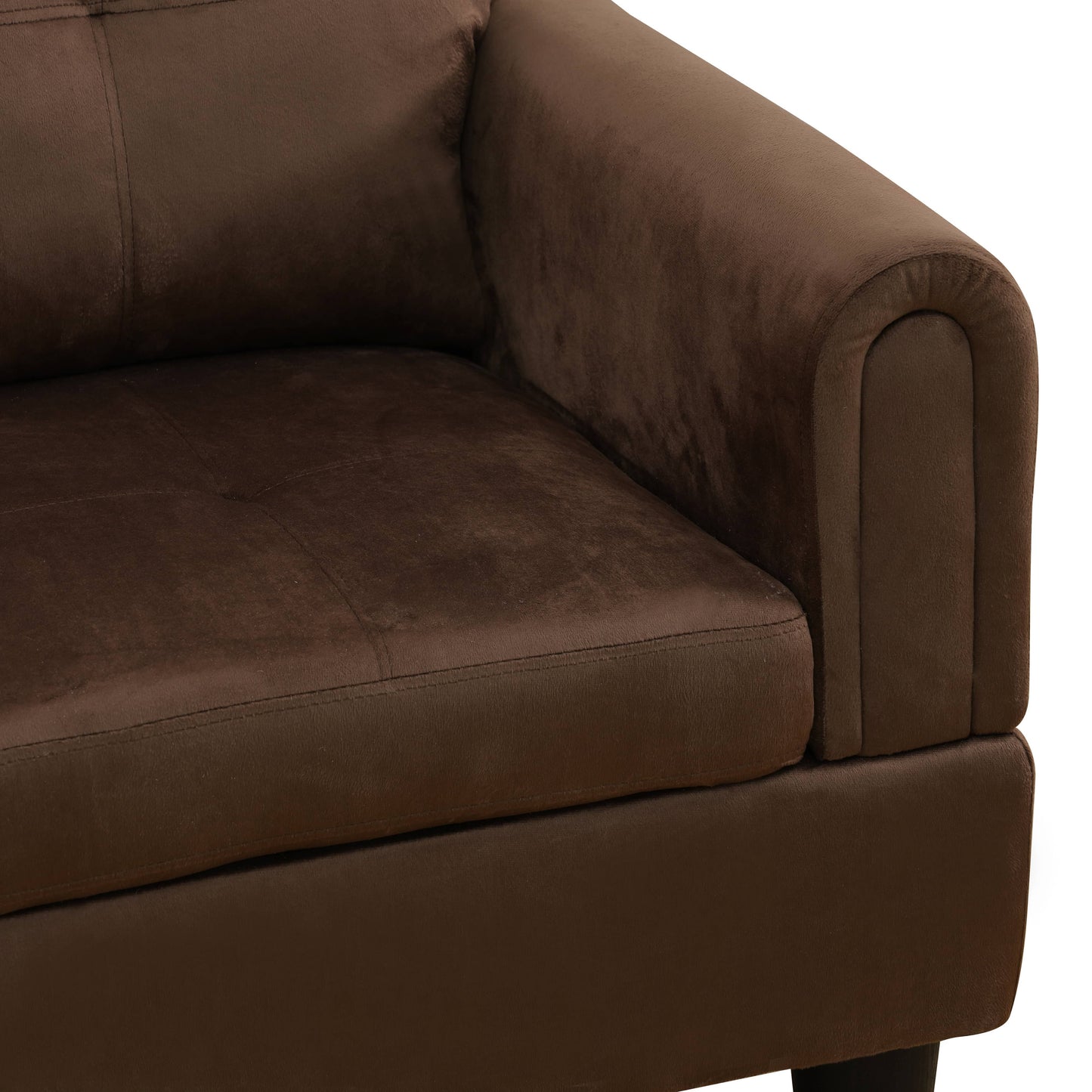 Brown upholstered sofa arm and seat cushion closeup
