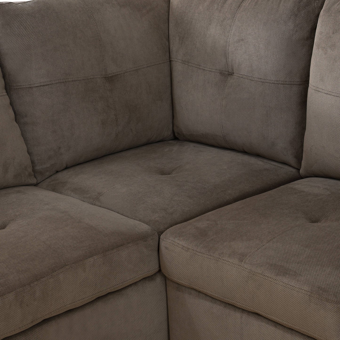 Plush brown fabric sectional sofa corner detail