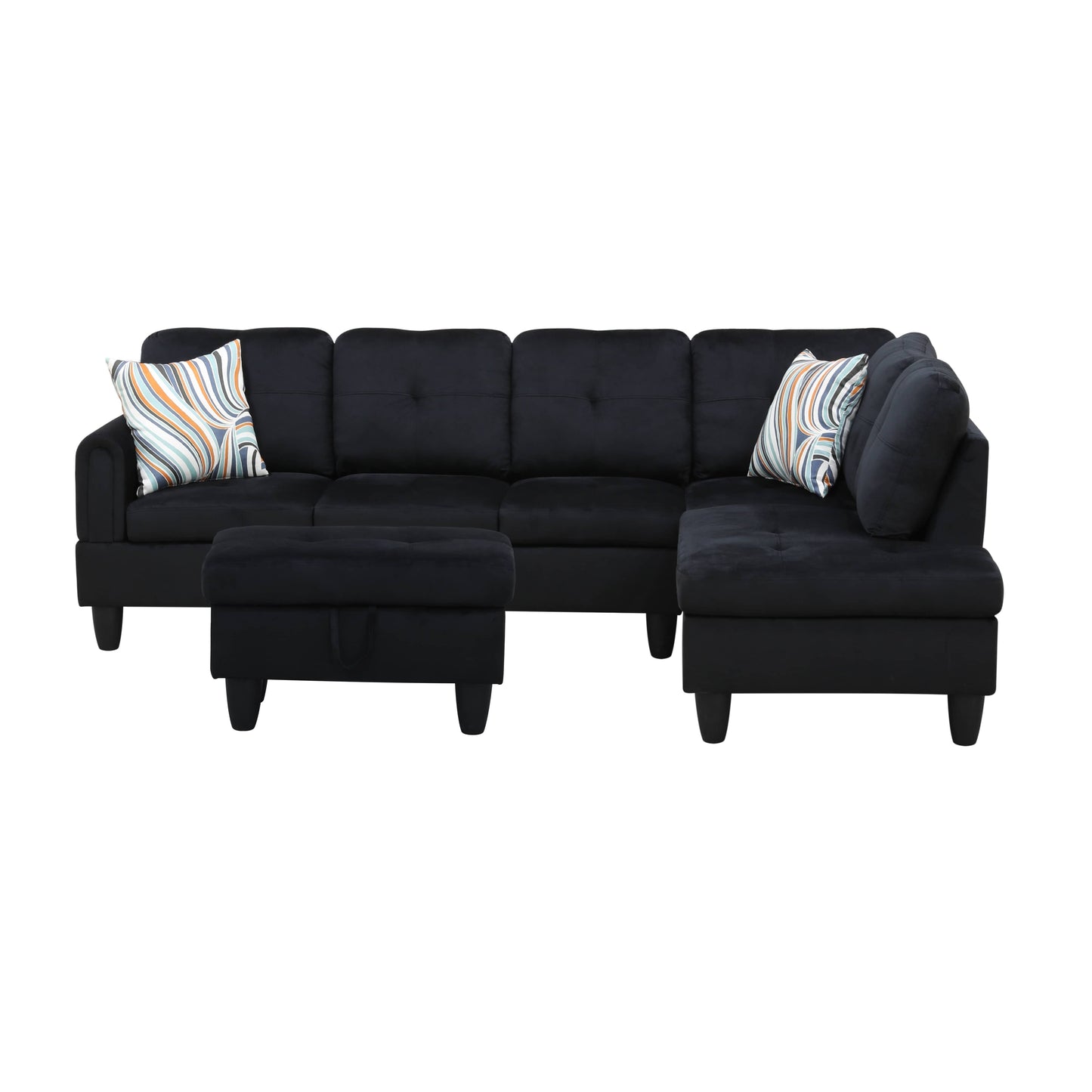 Black velvet sectional sofa with tufted cushions and geometric pattern pillows