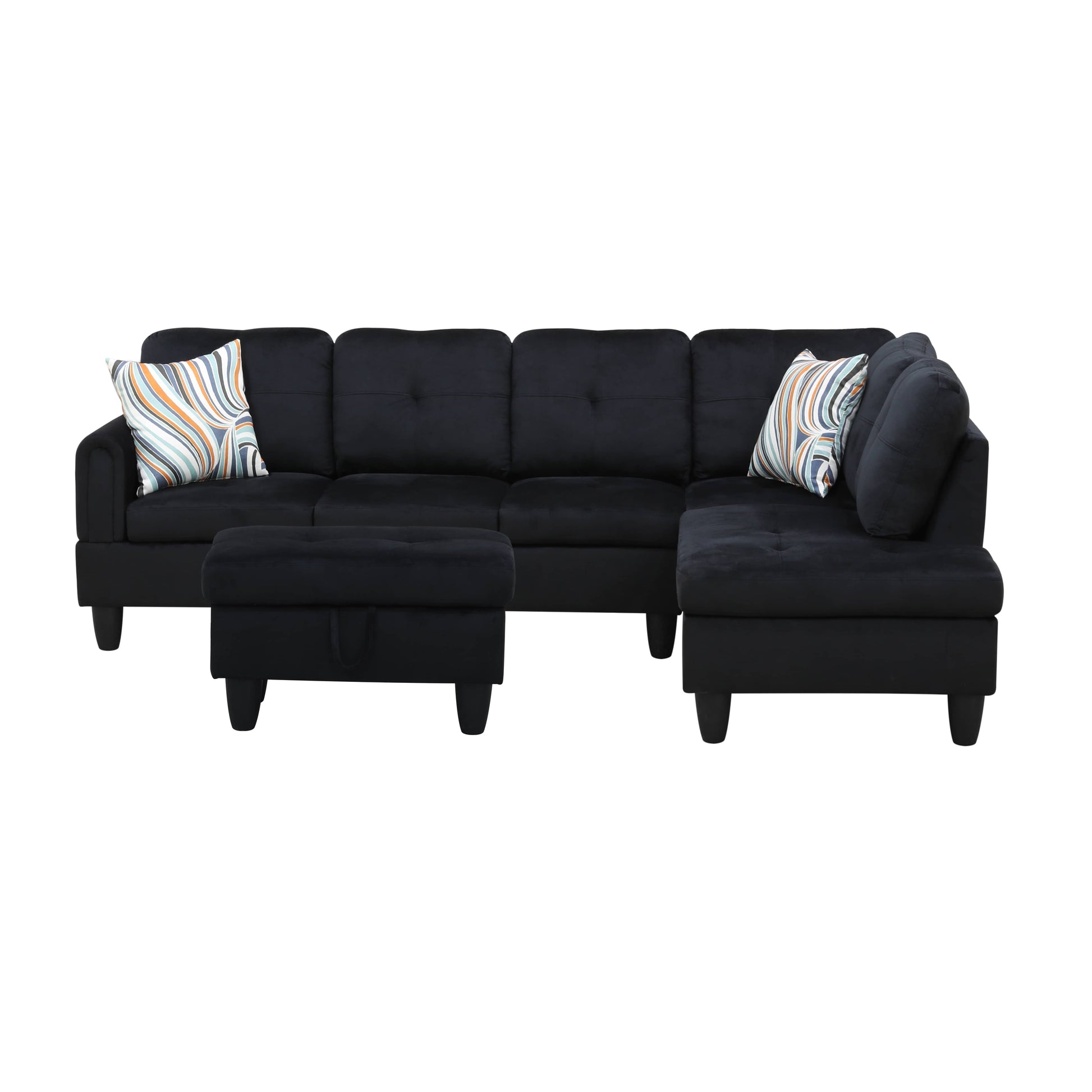 Black velvet sectional sofa with tufted cushions and geometric pattern pillows