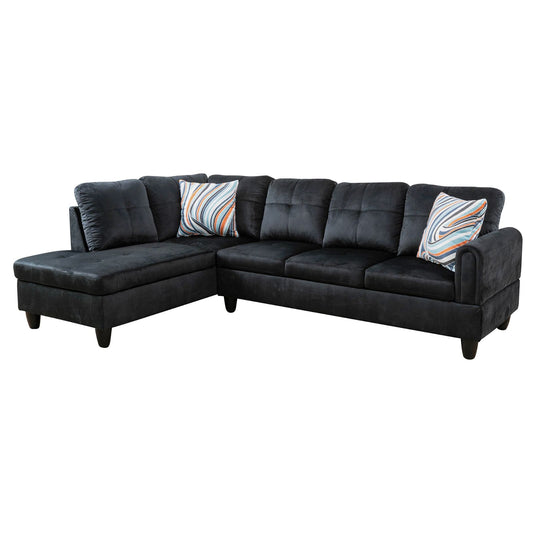 Black sectional sofa with plush cushions and two decorative throw pillows