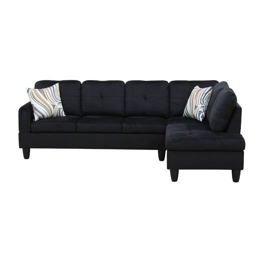 Black velvet sectional sofa with tufted cushions and abstract pattern throw pillows