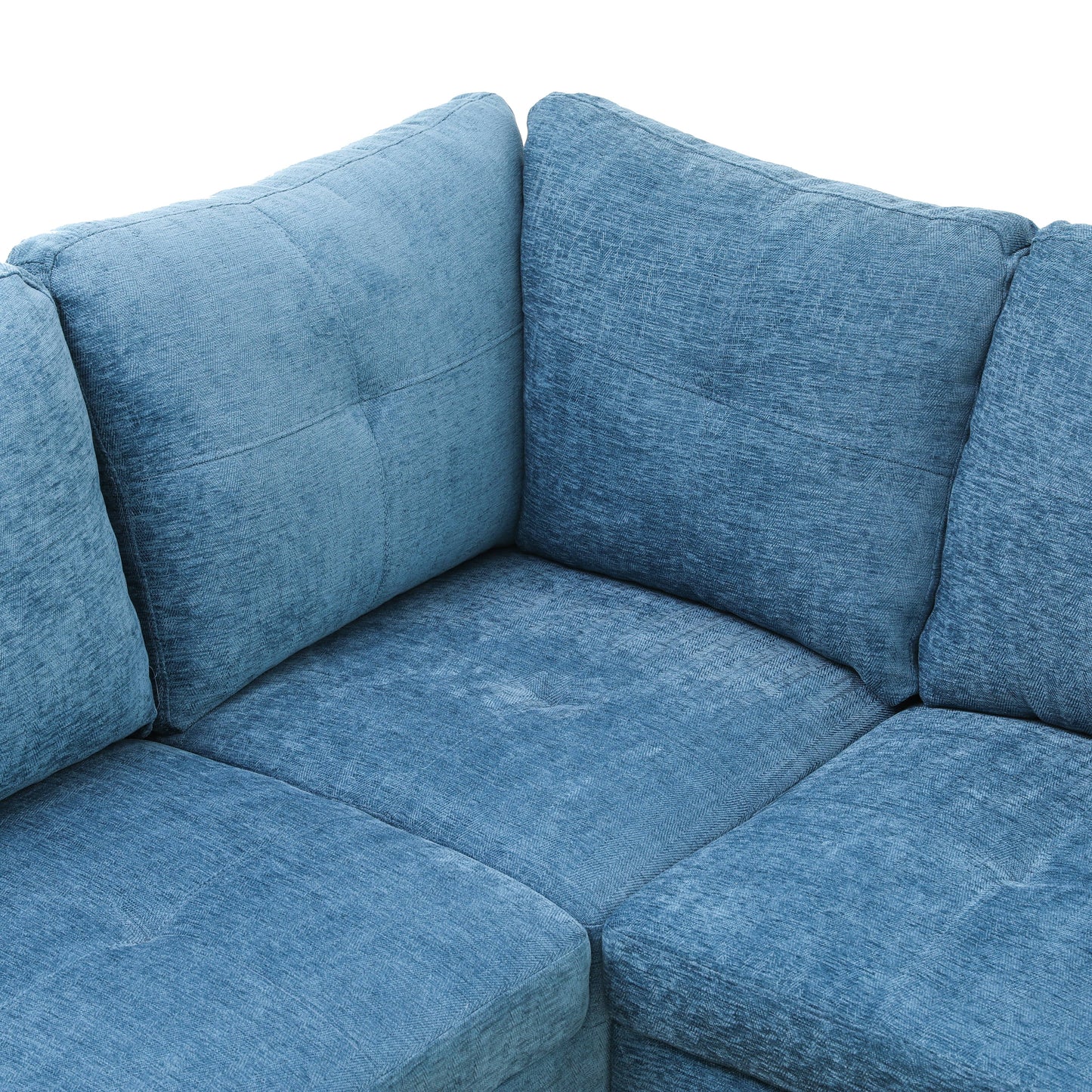 Closeup of textured blue fabric corner sofa with plush cushions