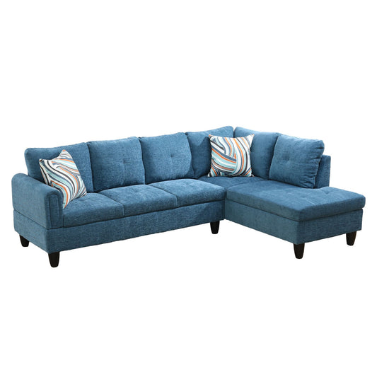 Blue fabric sectional sofa with tufted seats and geometric patterned pillows
