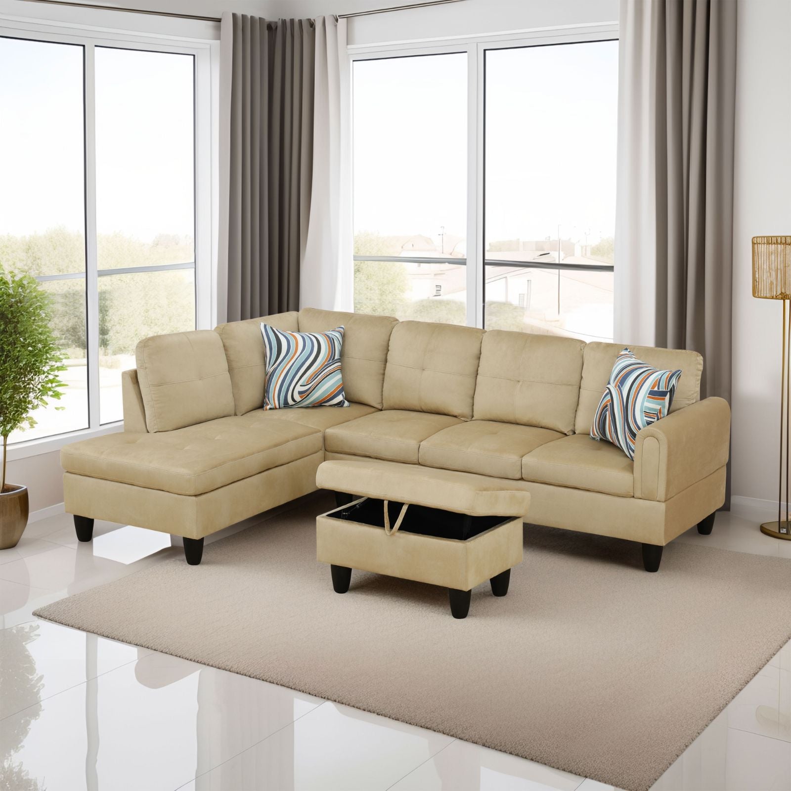 Tan suede sectional sofa with storage ottoman and striped accent pillows