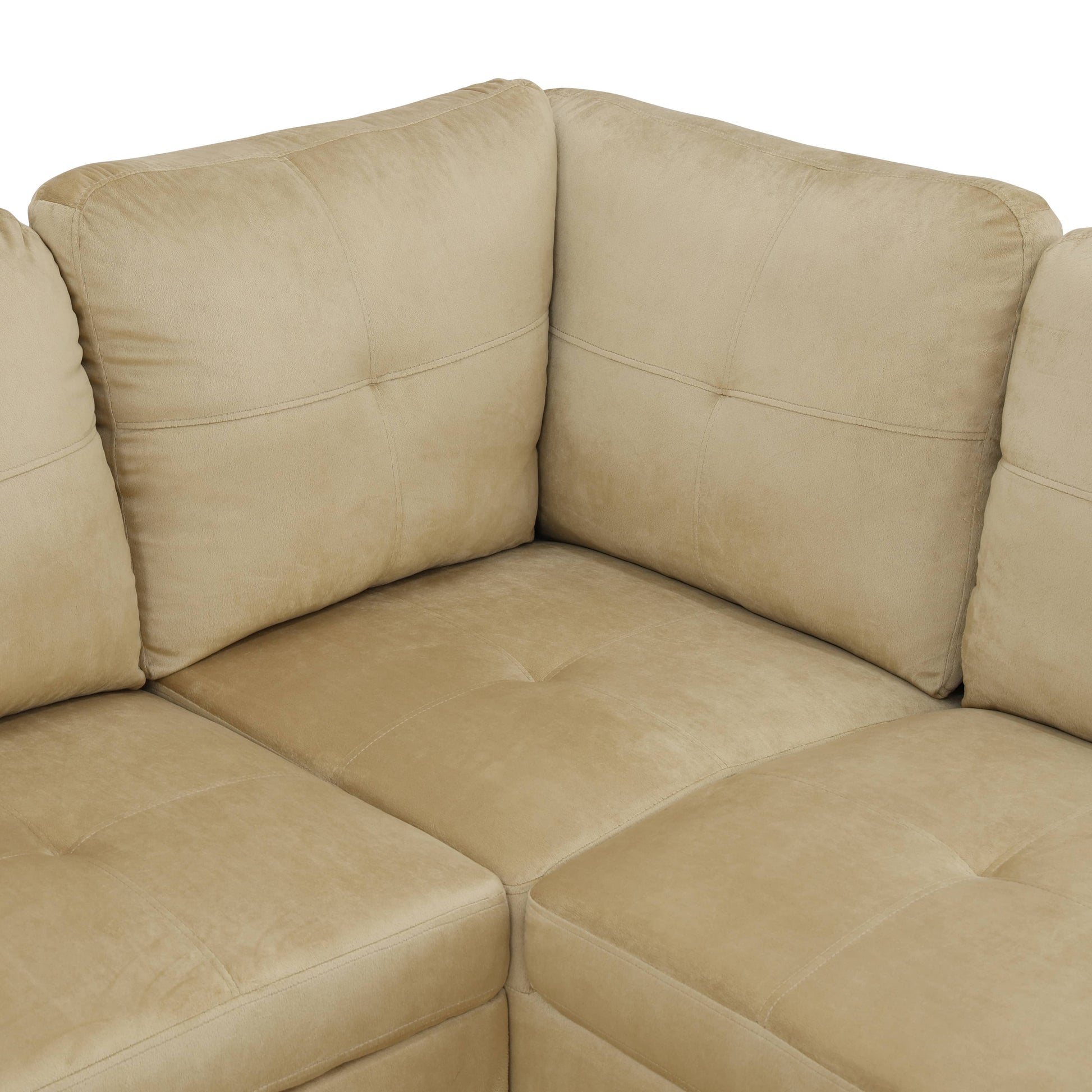 Beige suede sectional sofa with tufted cushions and modern stitching