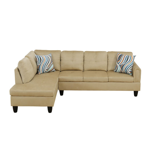 Beige sectional sofa with tufted cushions and a modern wavy pattern throw pillow