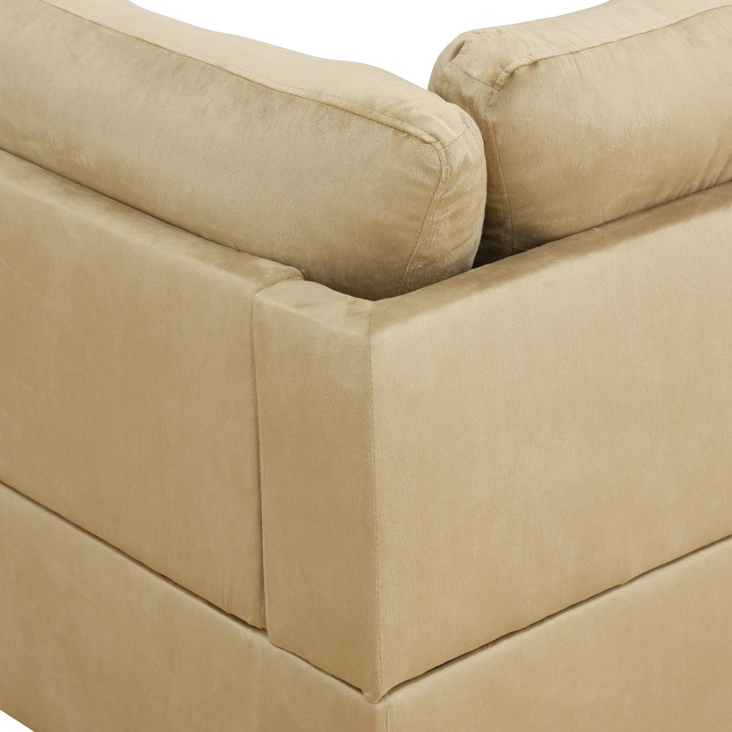 Closeup of plush beige velvet sofa corner and cushion texture