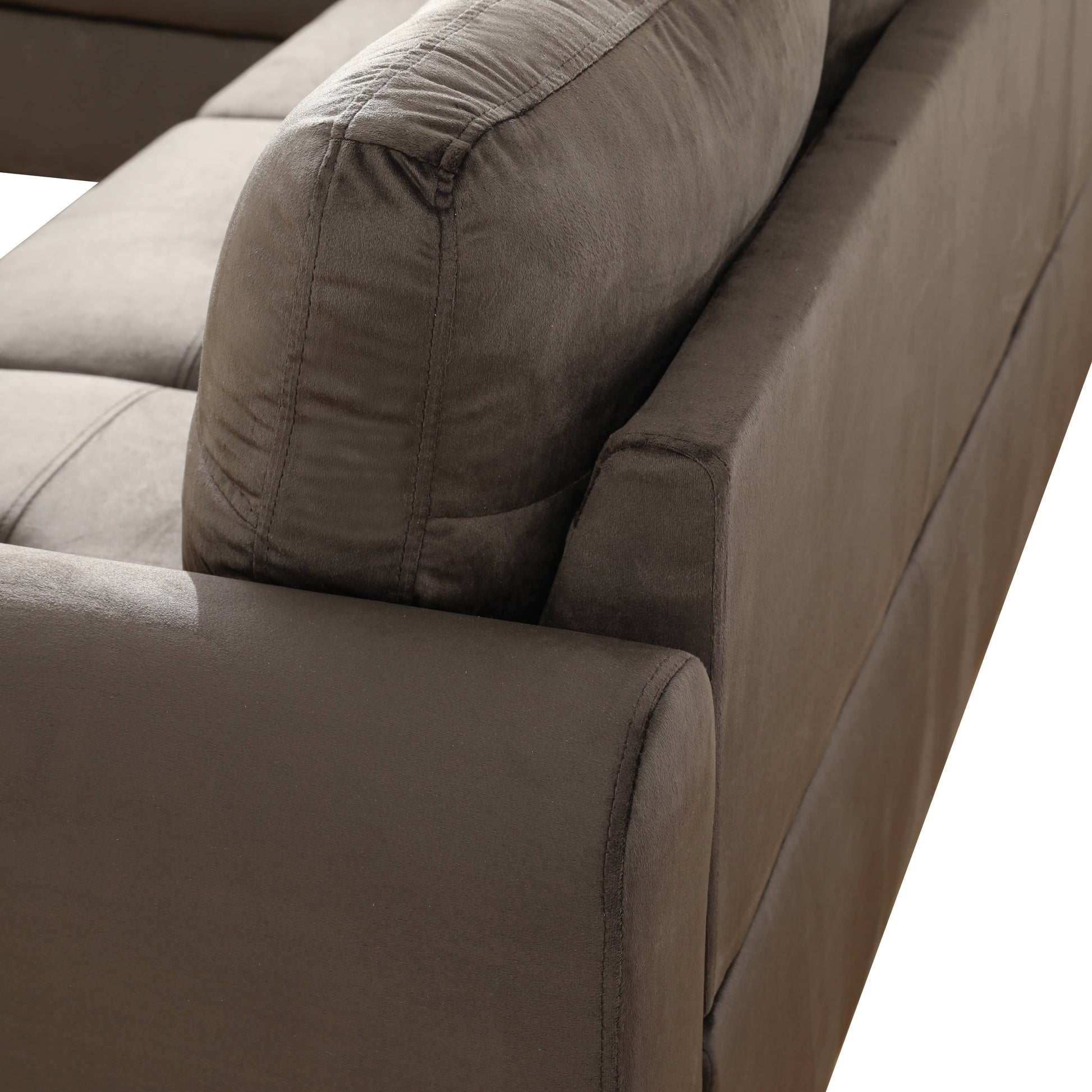 Dark brown plush fabric sofa corner detail