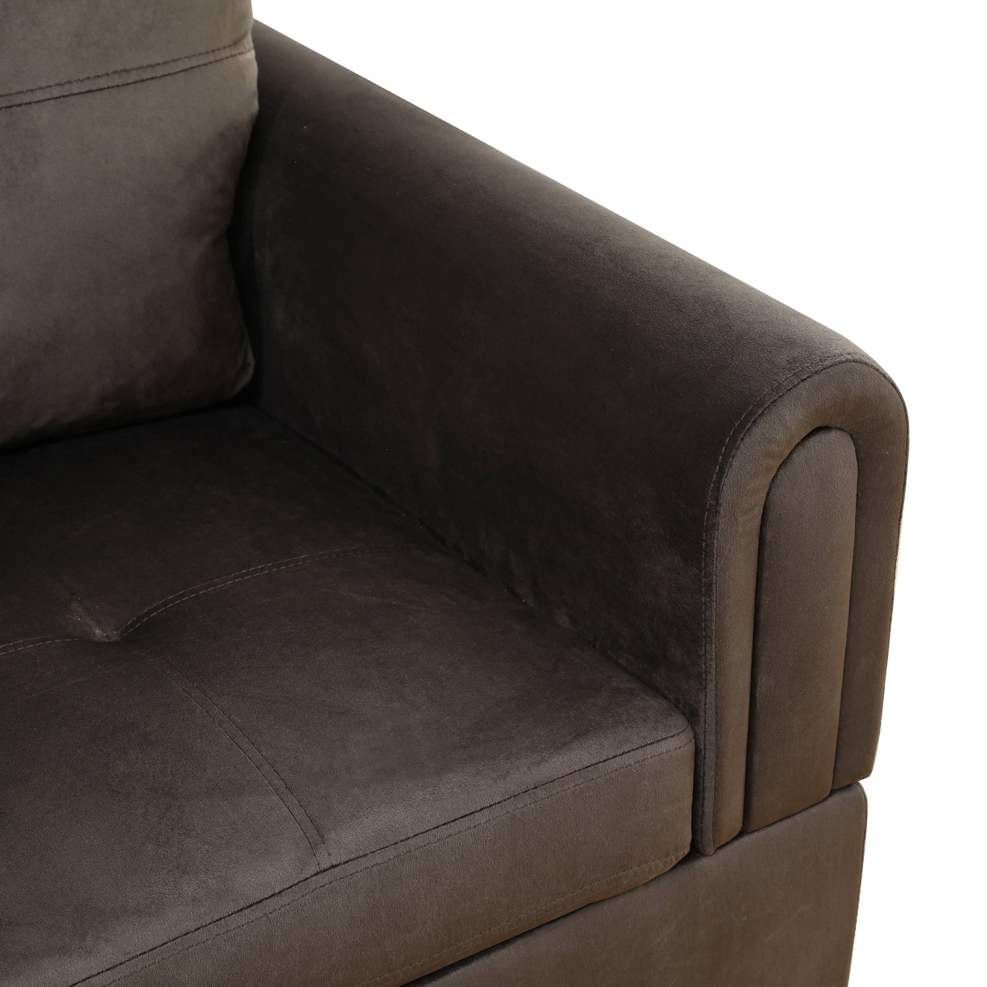 Dark brown velvet sofa arm with stitched cushion detail