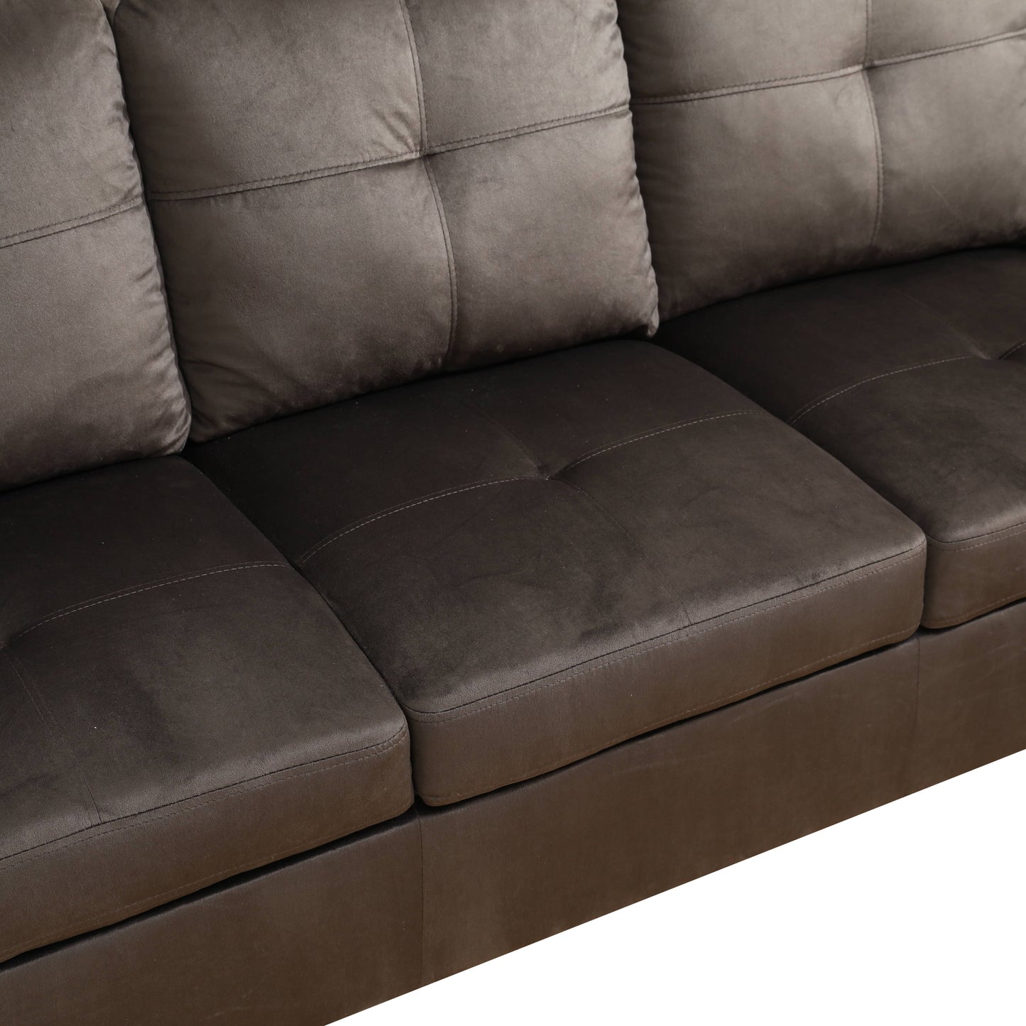 Tufted charcoal gray sofa with plush cushions