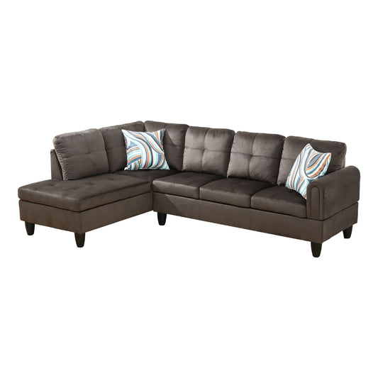Dark brown velvet sectional sofa with tufted cushions and abstract patterned pillows