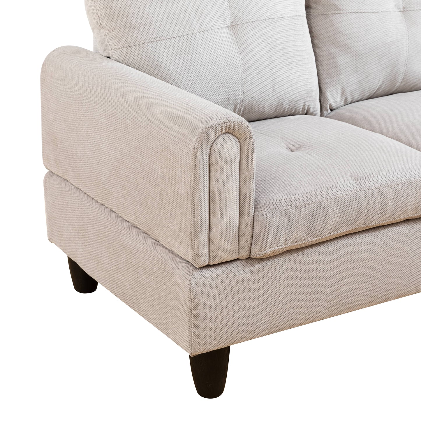 Light grey fabric sectional sofa armrest with button tufted cushions and dark wooden legs
