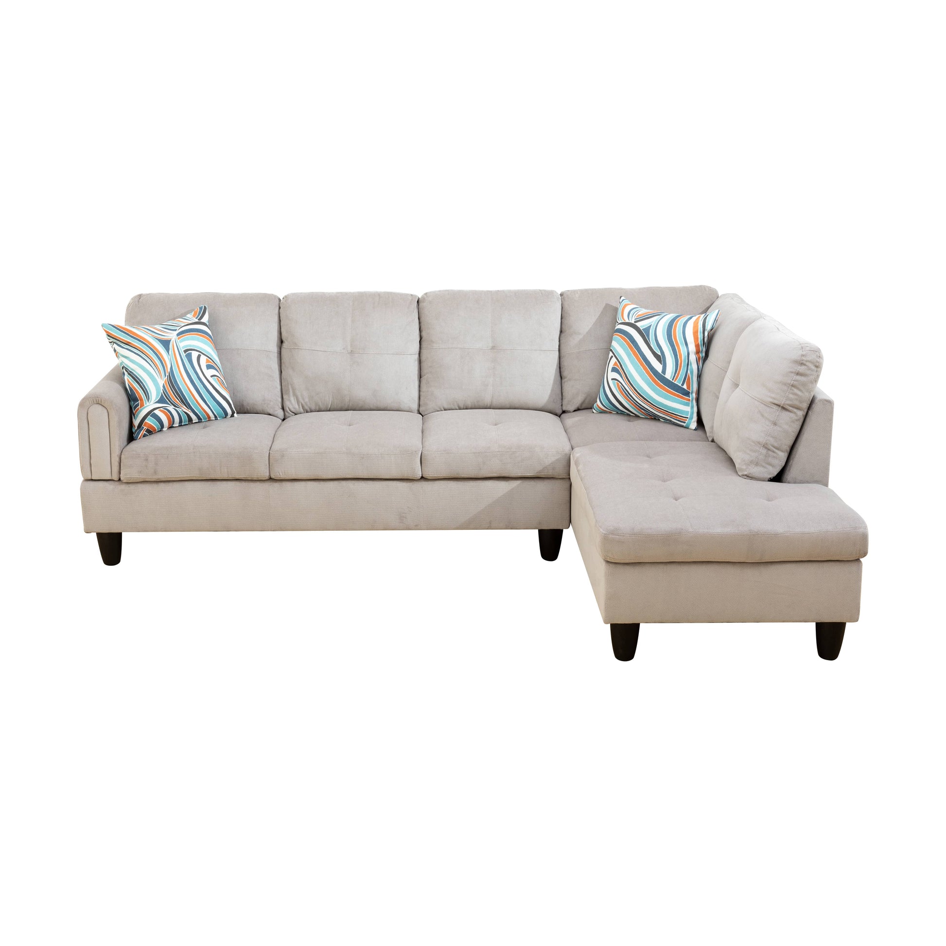 Light gray sectional sofa with plush cushions and abstract patterned throw pillows