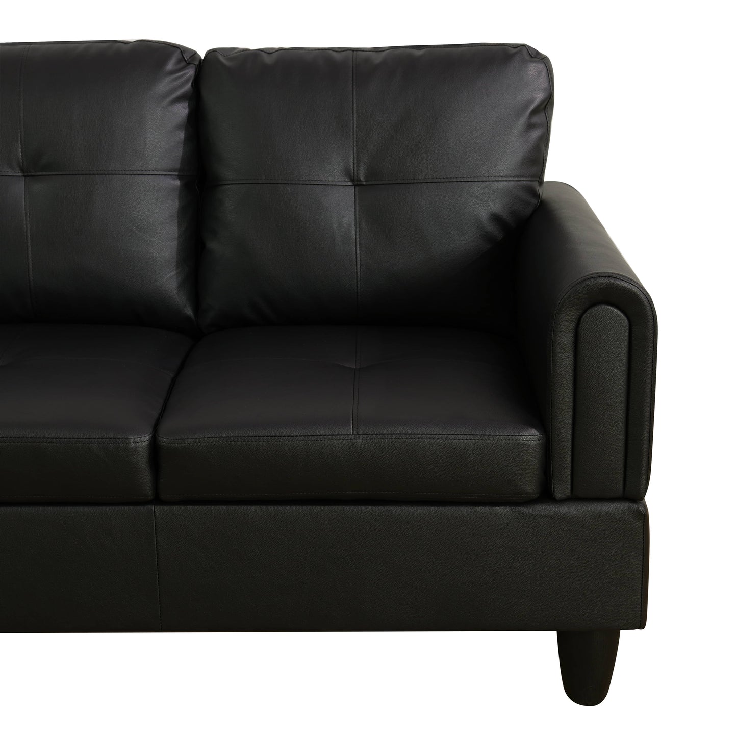 Black leather sofa with tufted cushions
