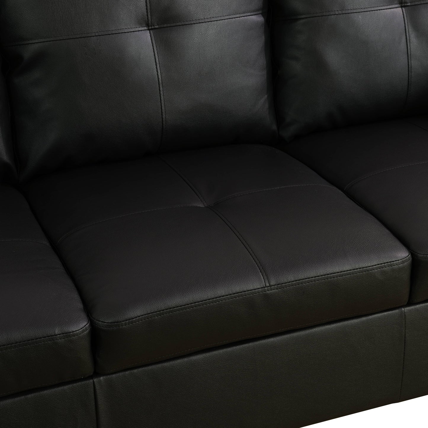 Closeup of a stitched black leather sofa seat cushion with subtle texture