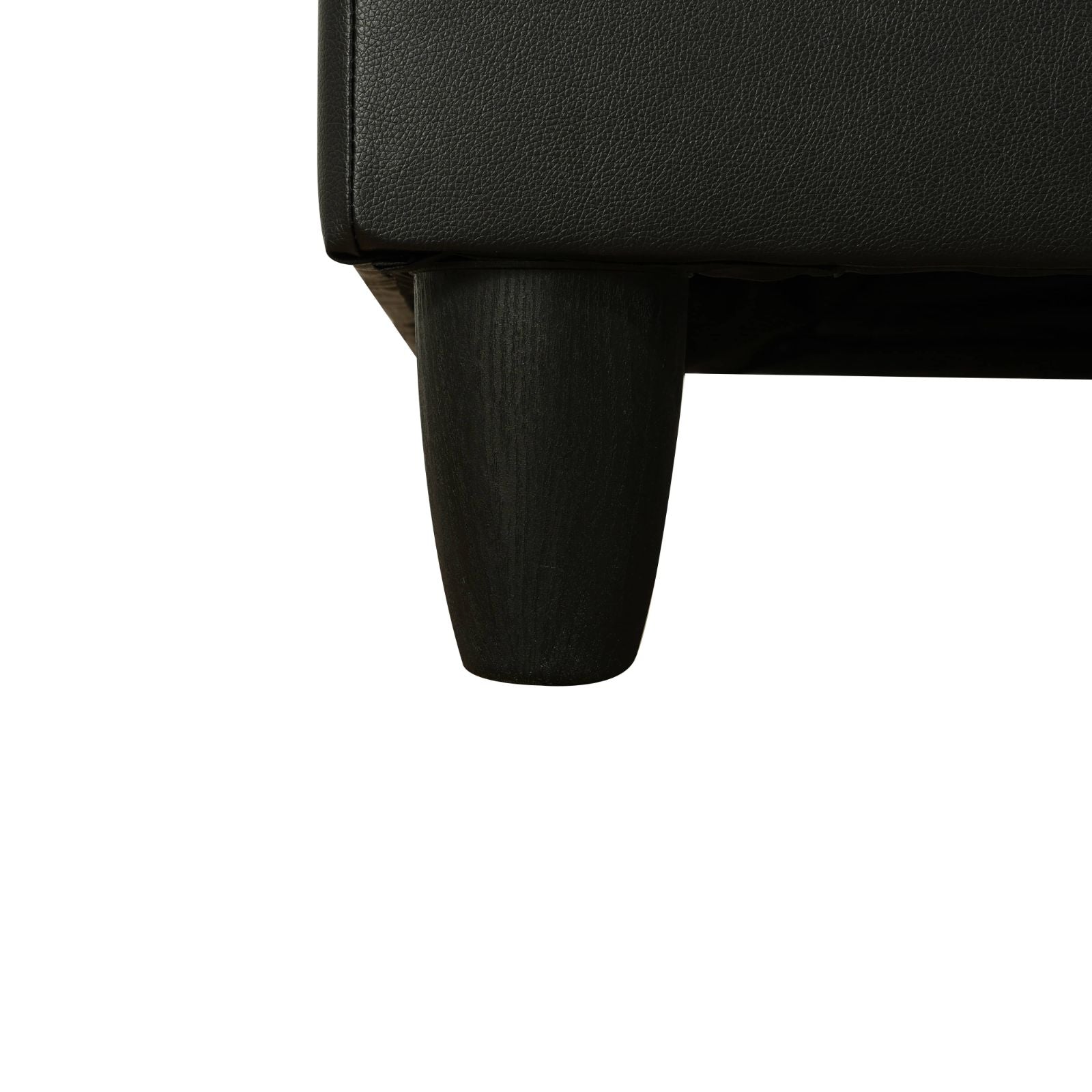 Black faux leather armchair detail with tapered wooden leg