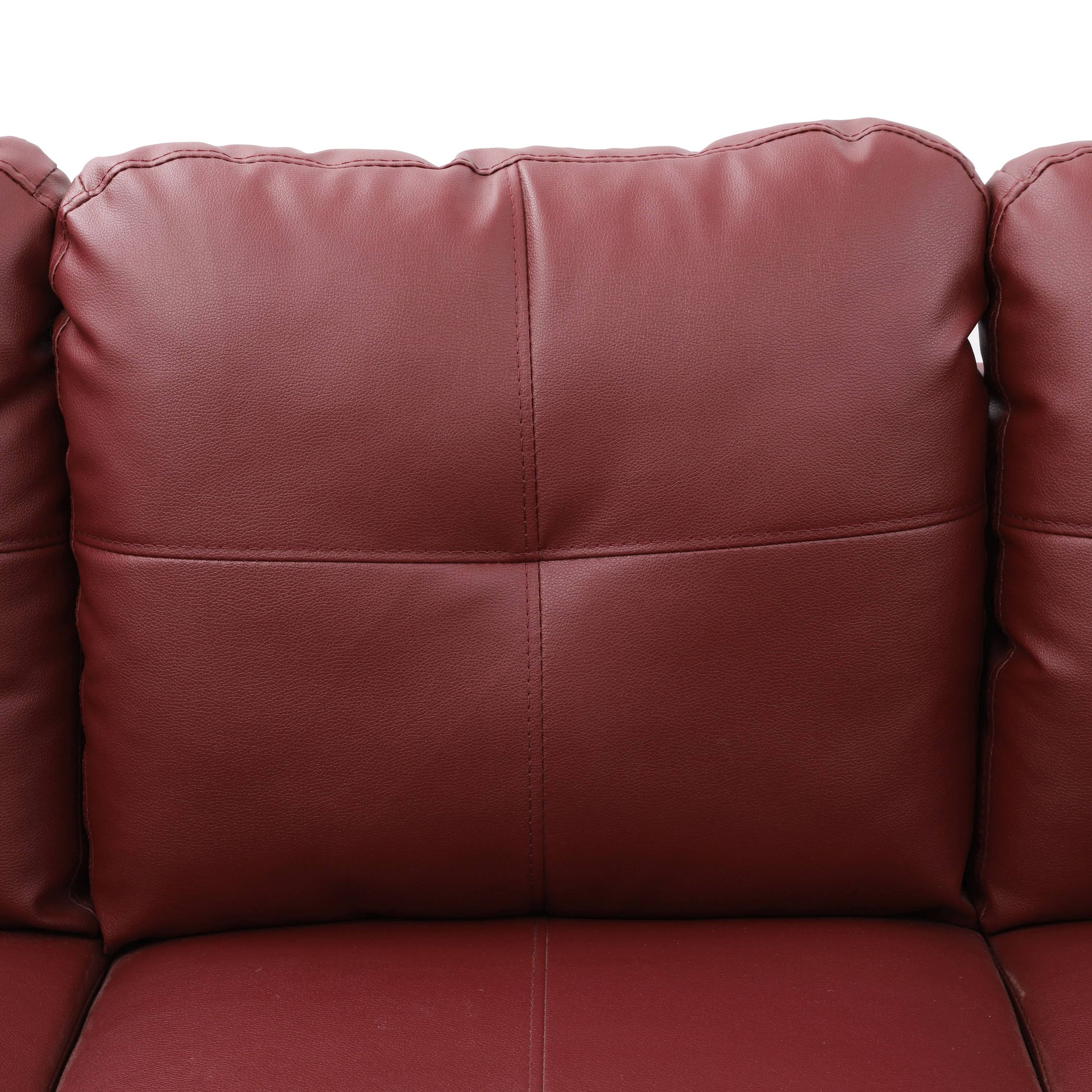 Red faux leather sofa cushion with detailed stitching